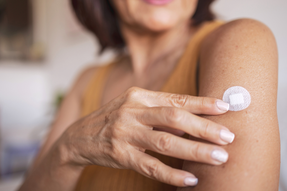 woman on with a bandage on her arm