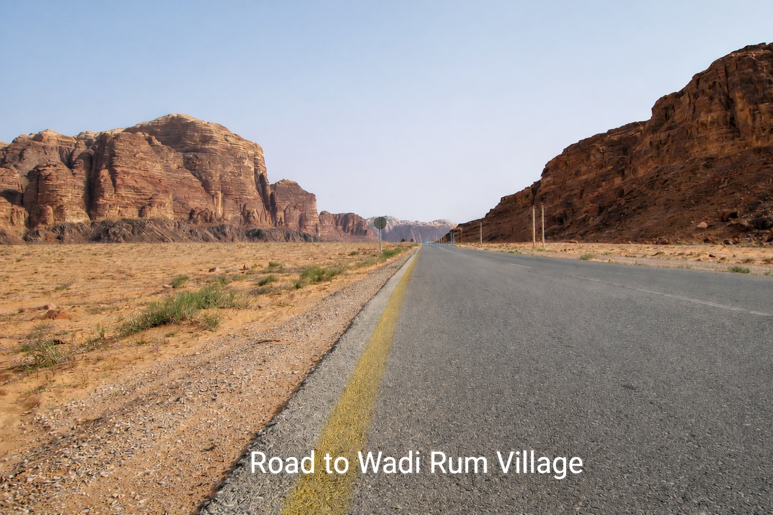 Desert road leading to Wadi Rum Village, Jordan