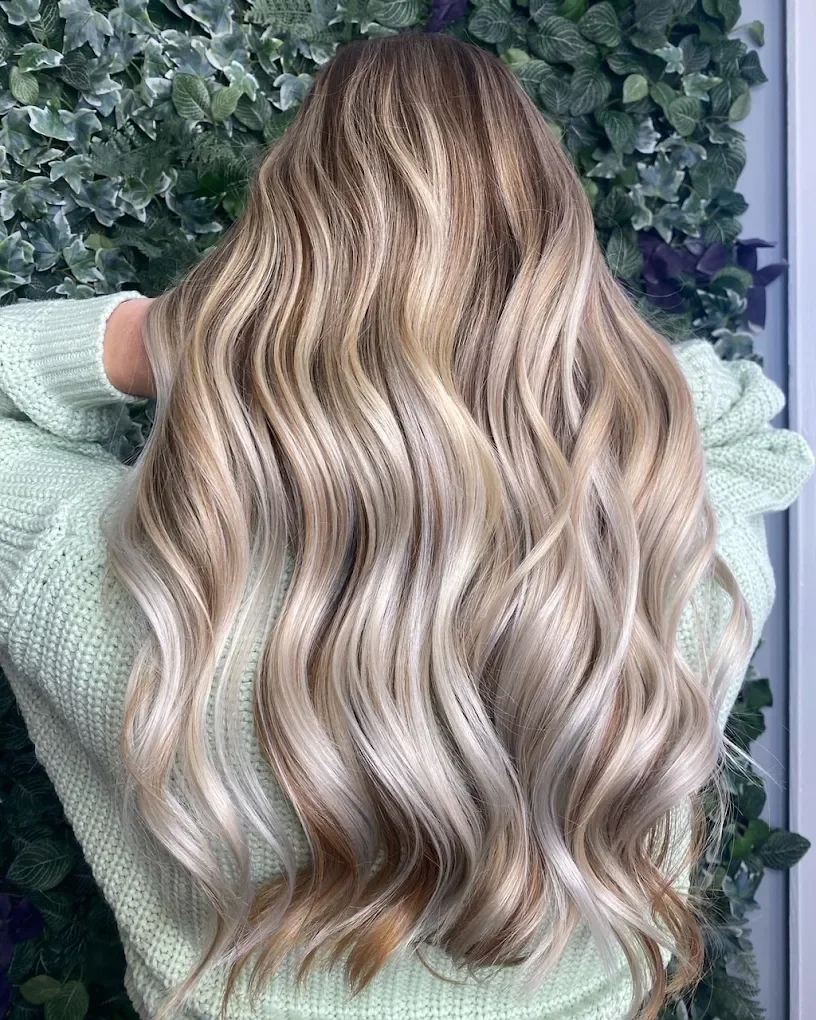 Blonde balayage with soft, dimensional waves, expert color services in West Hartford