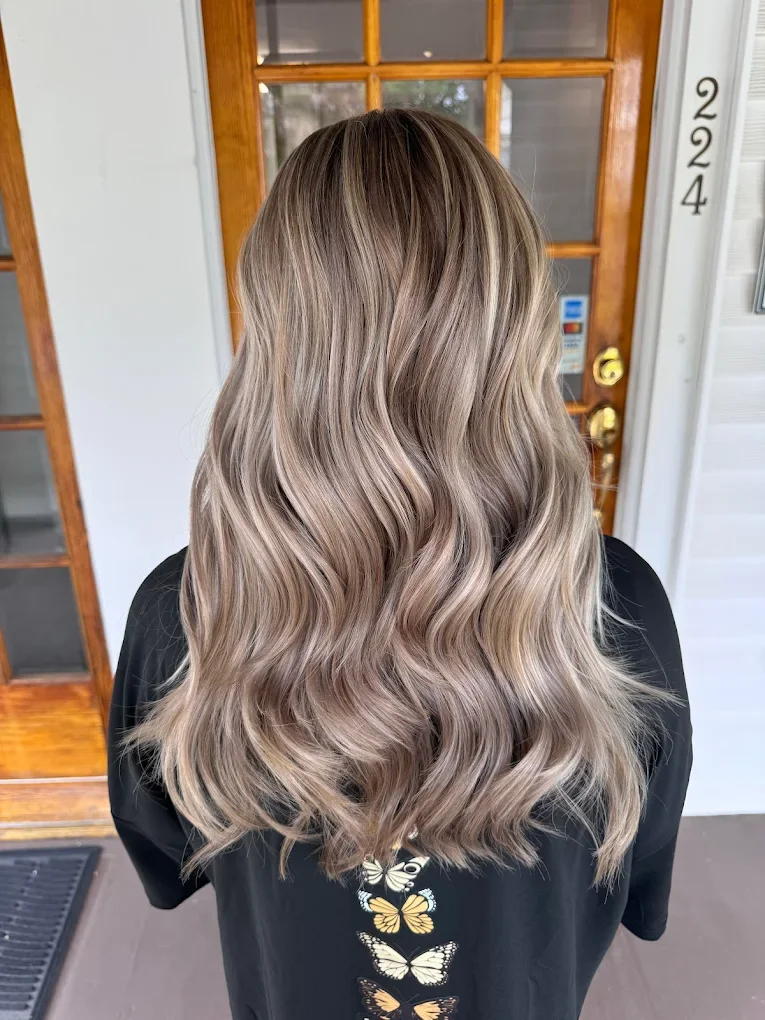 A low-maintenance balayage with blended tones and soft movement, designed to grow out beautifully.