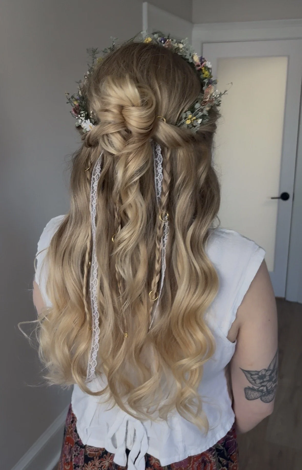 A half-up style with gentle braiding for added detail and dimension.