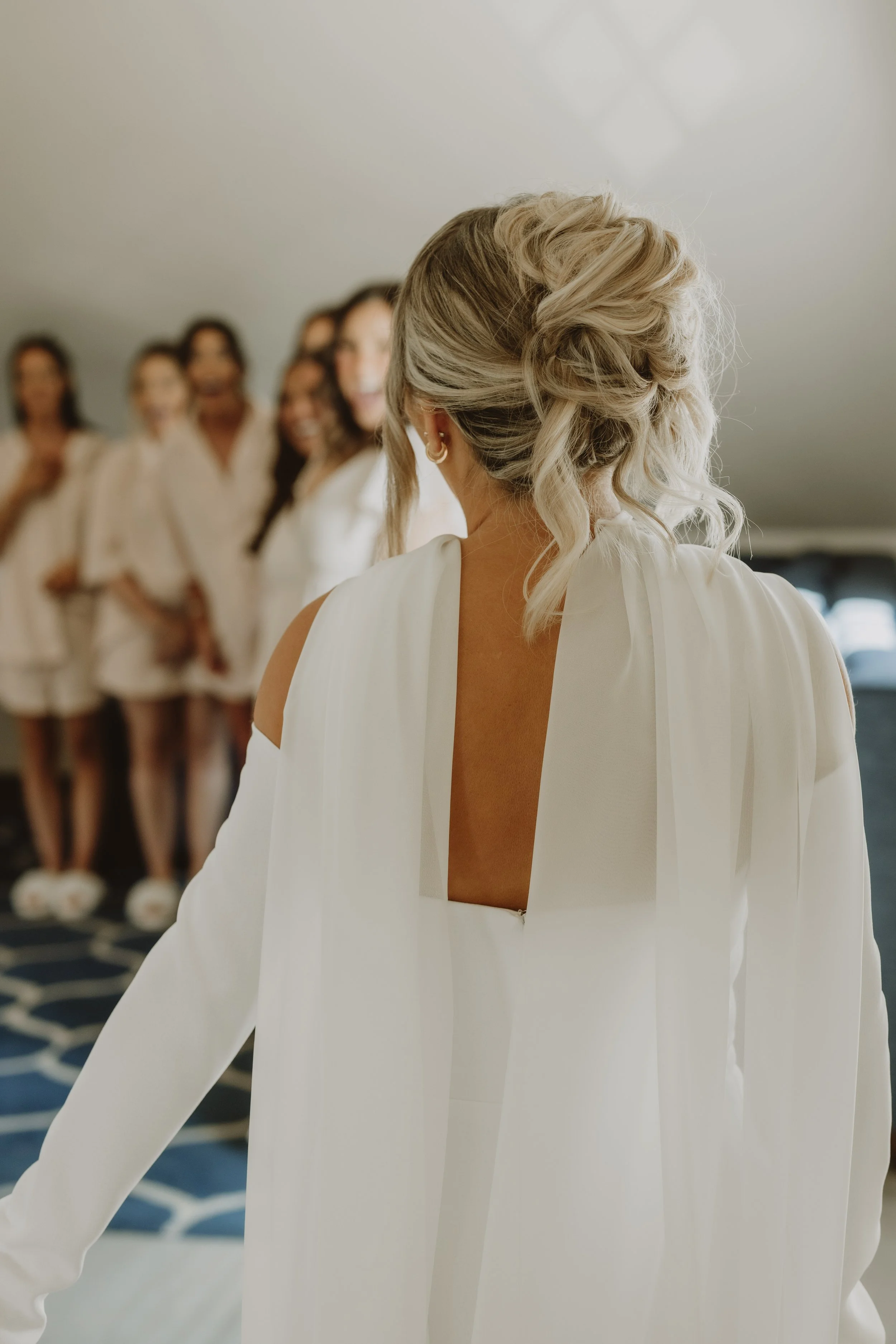 A relaxed bridal updo designed to hold throughout the day while still feeling light and natural.