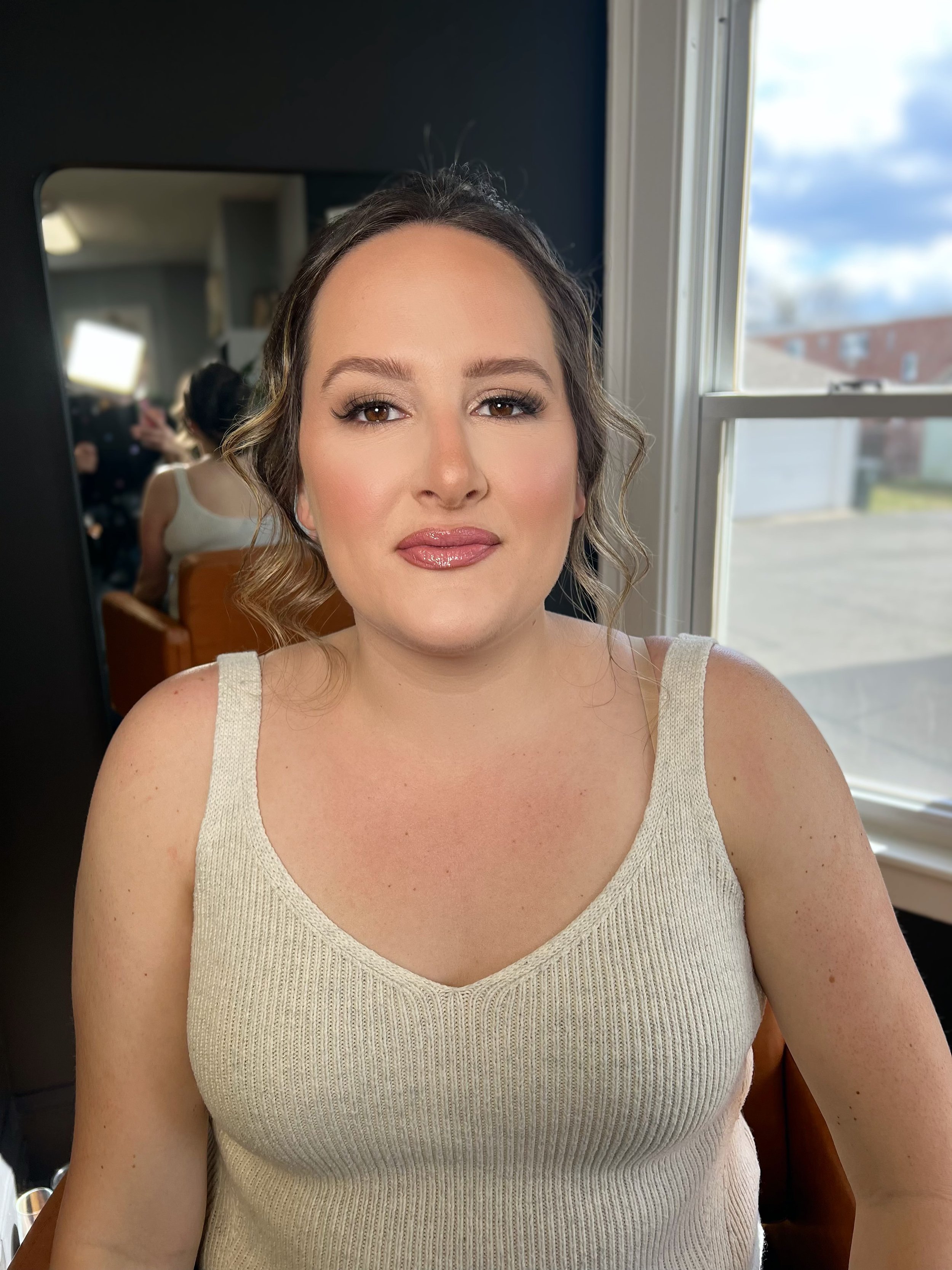 An elevated bridal makeup look with balanced definition and smooth, glowing skin.