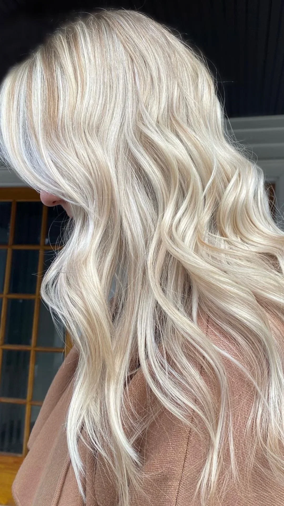 Bright blonde hair with glossy finish