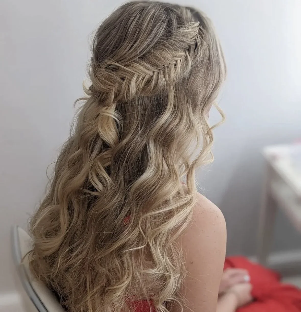 Braided crown hairstyle with soft waves, bridal hair styling by Do’s & Dye in West Hartford