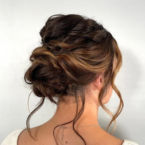 Elegant bridal updo with braids and soft curls, wedding hair styling at Do’s & Dye West Hartford