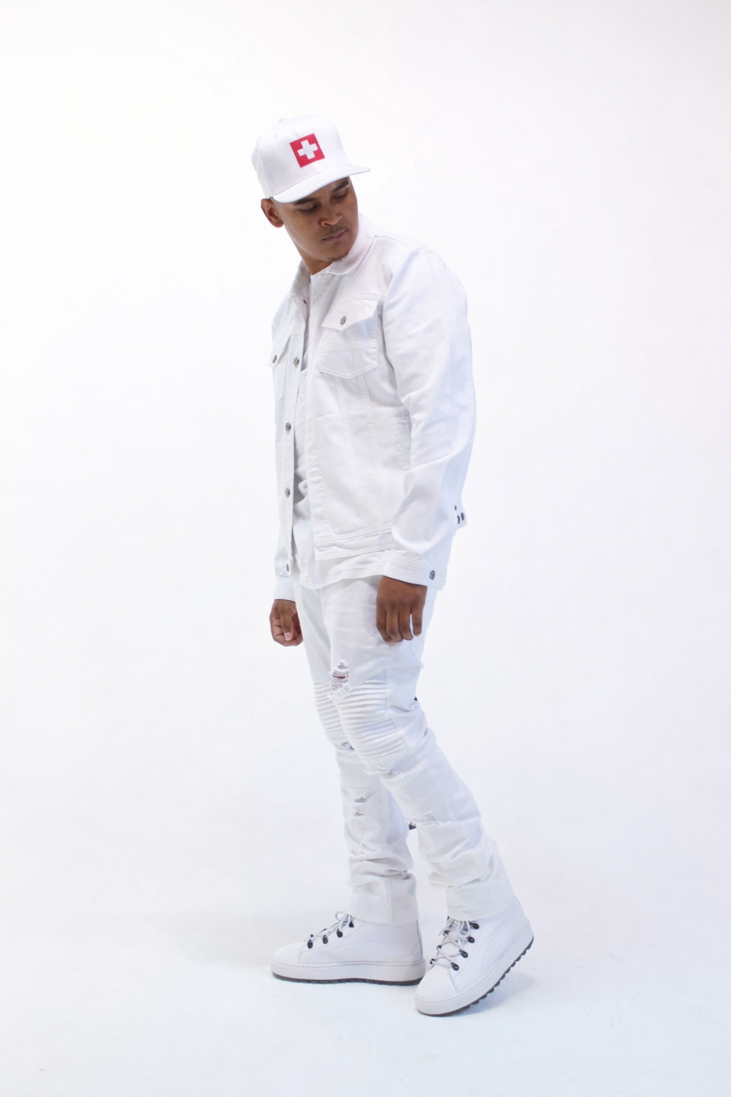 CV$H press photo wearing white outfit in studio setting