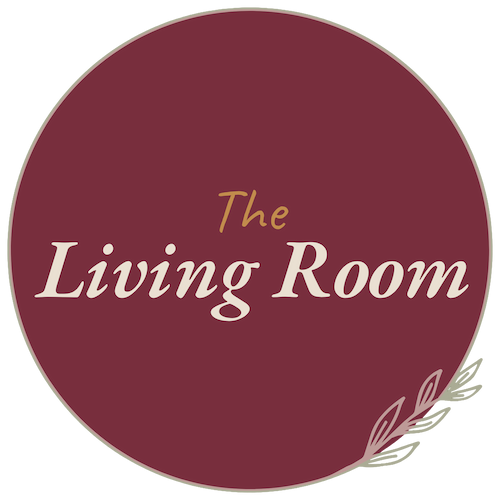 Circle with maroon background and beige text reading 'The Living Room'.