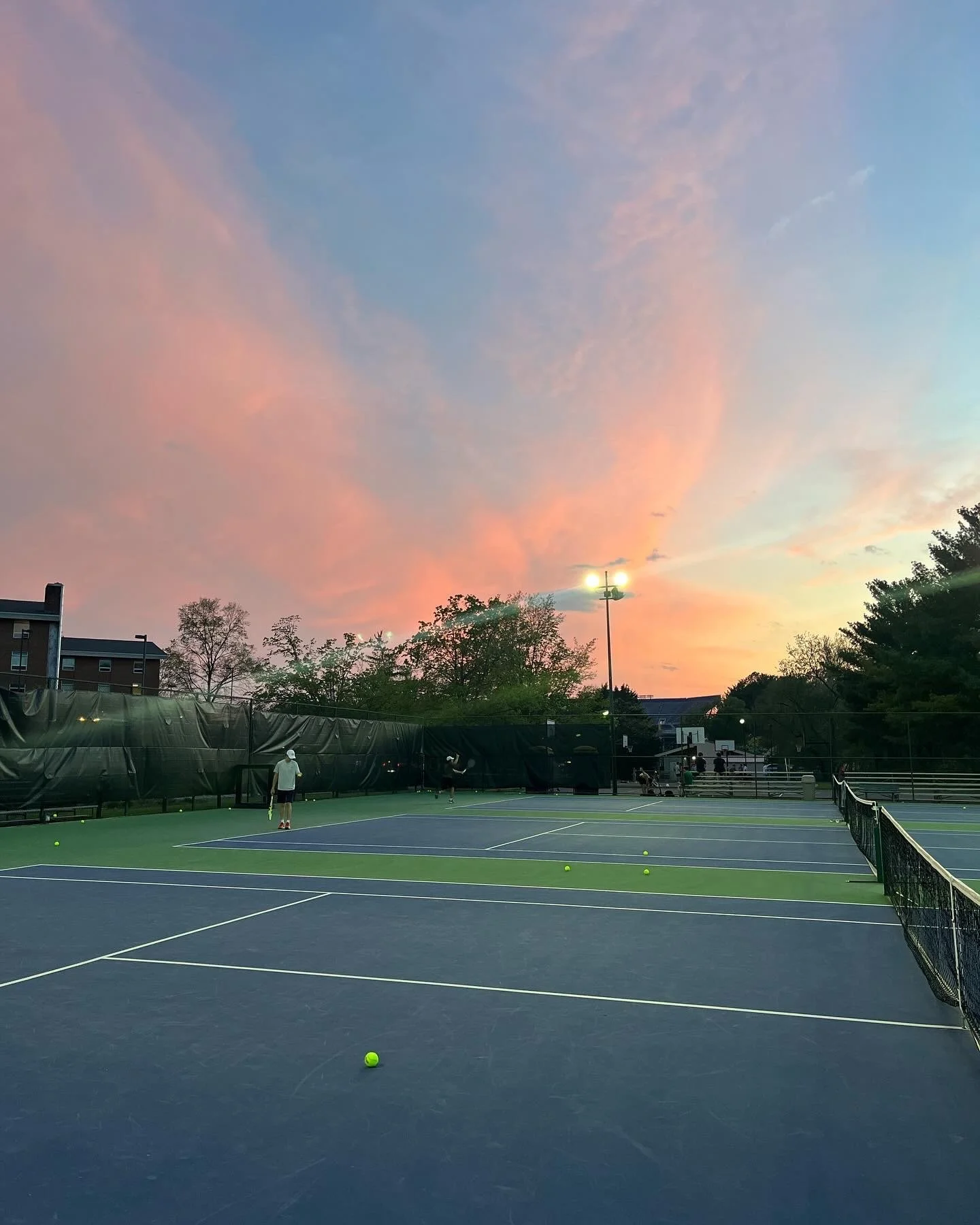 A sunset view above the courts from practice