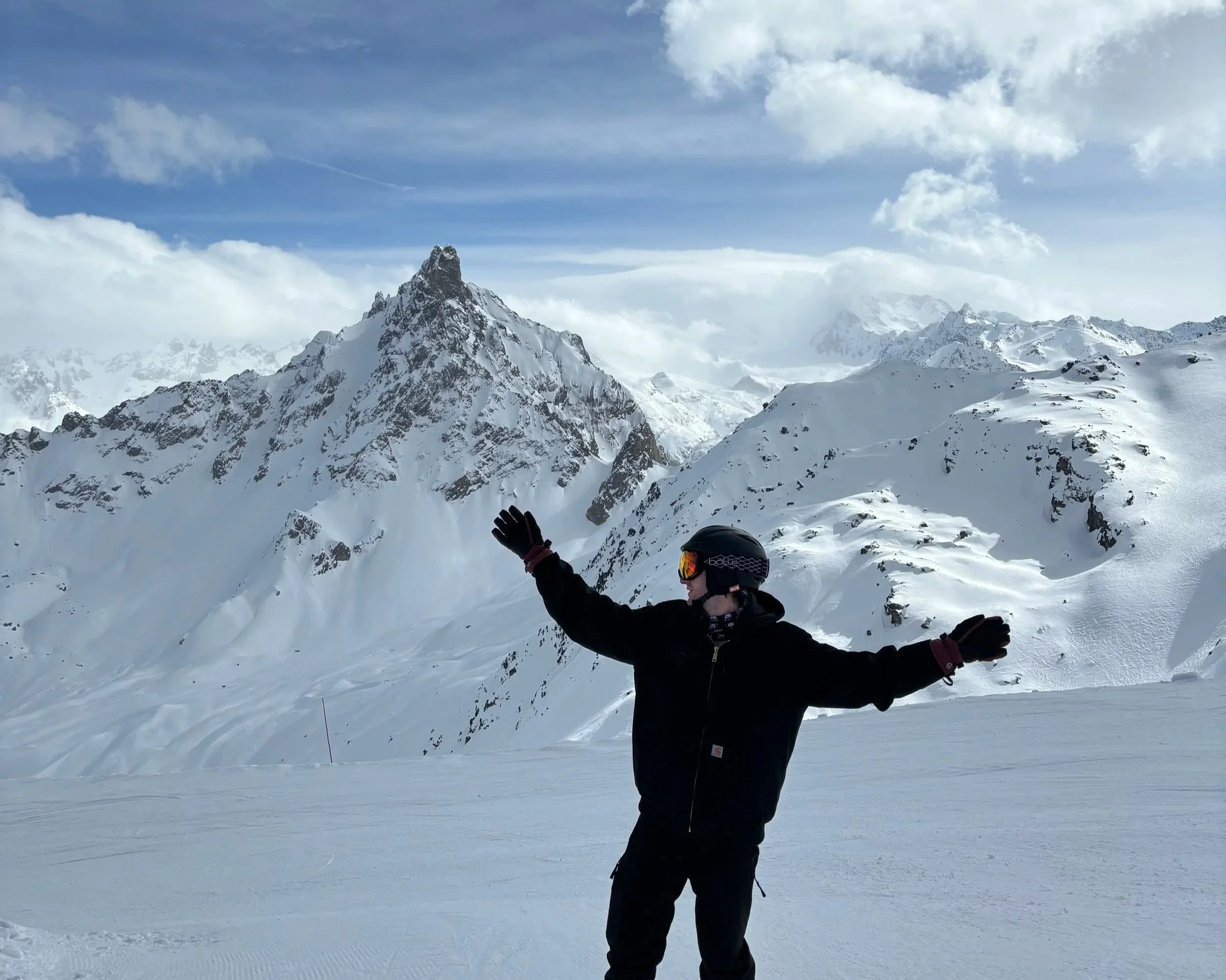 Posing in front of a beautiful mountain top.