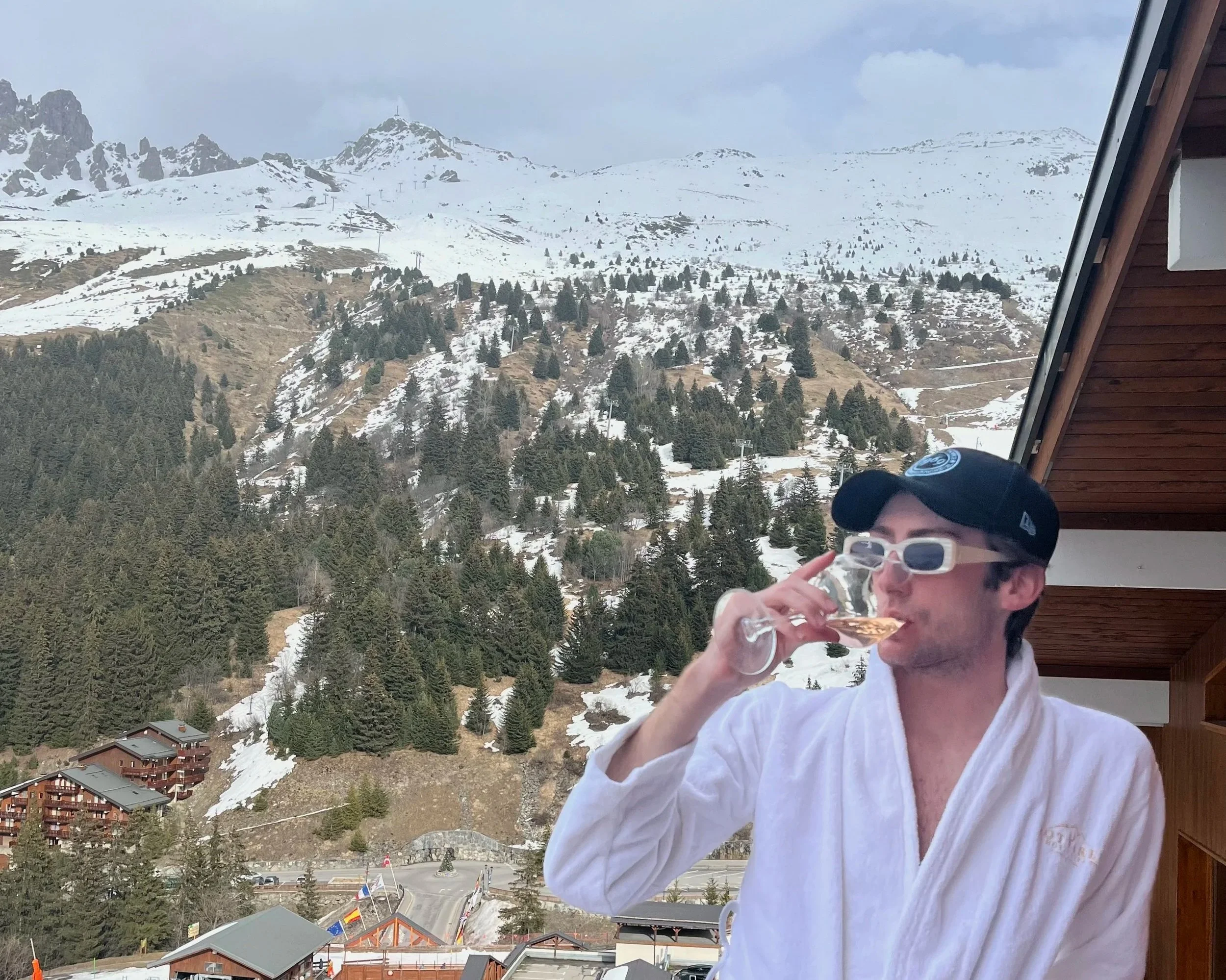 Posing in a robe with a beverage after warming up in the hot tub.