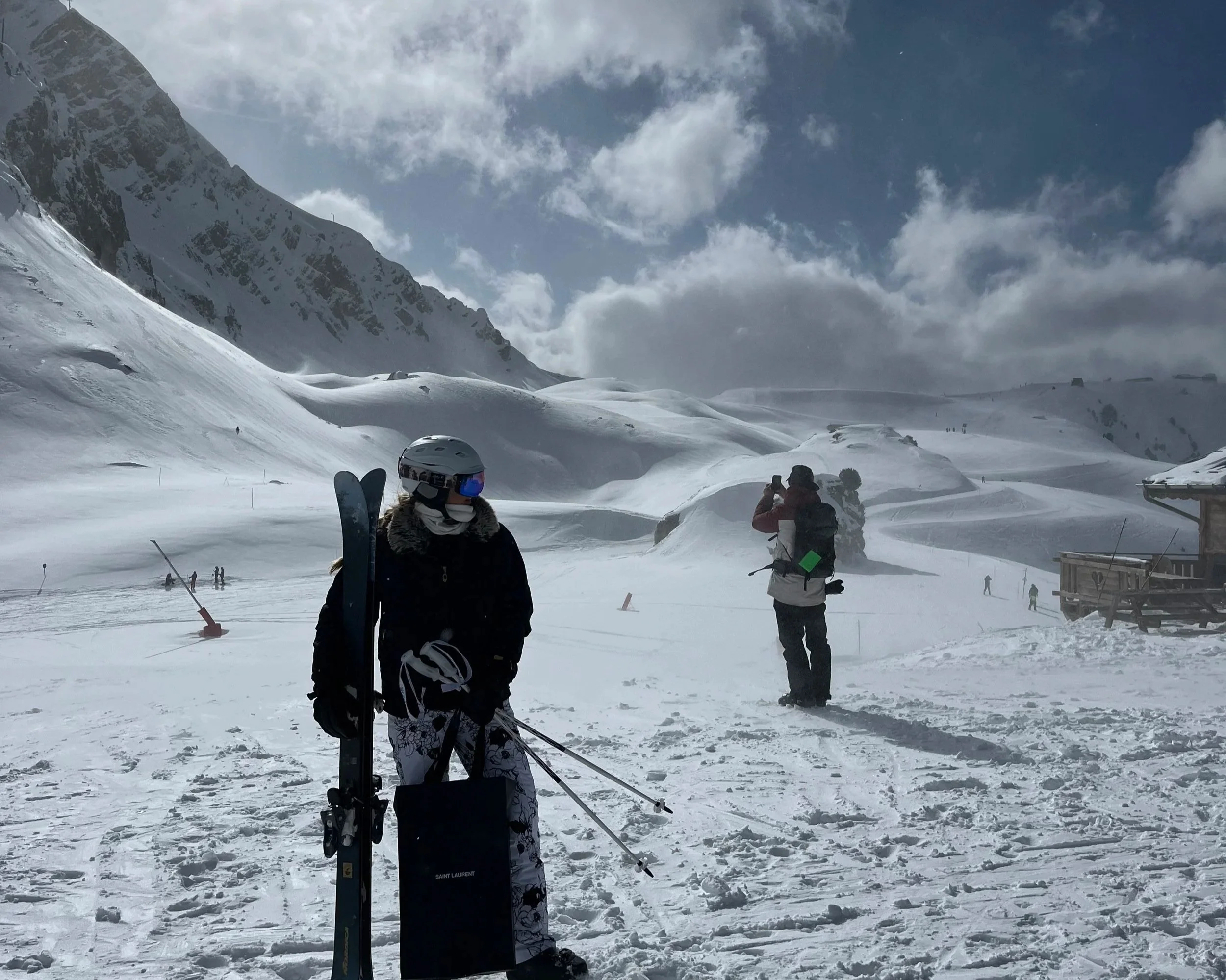 My cousin posing on top of a mountain.