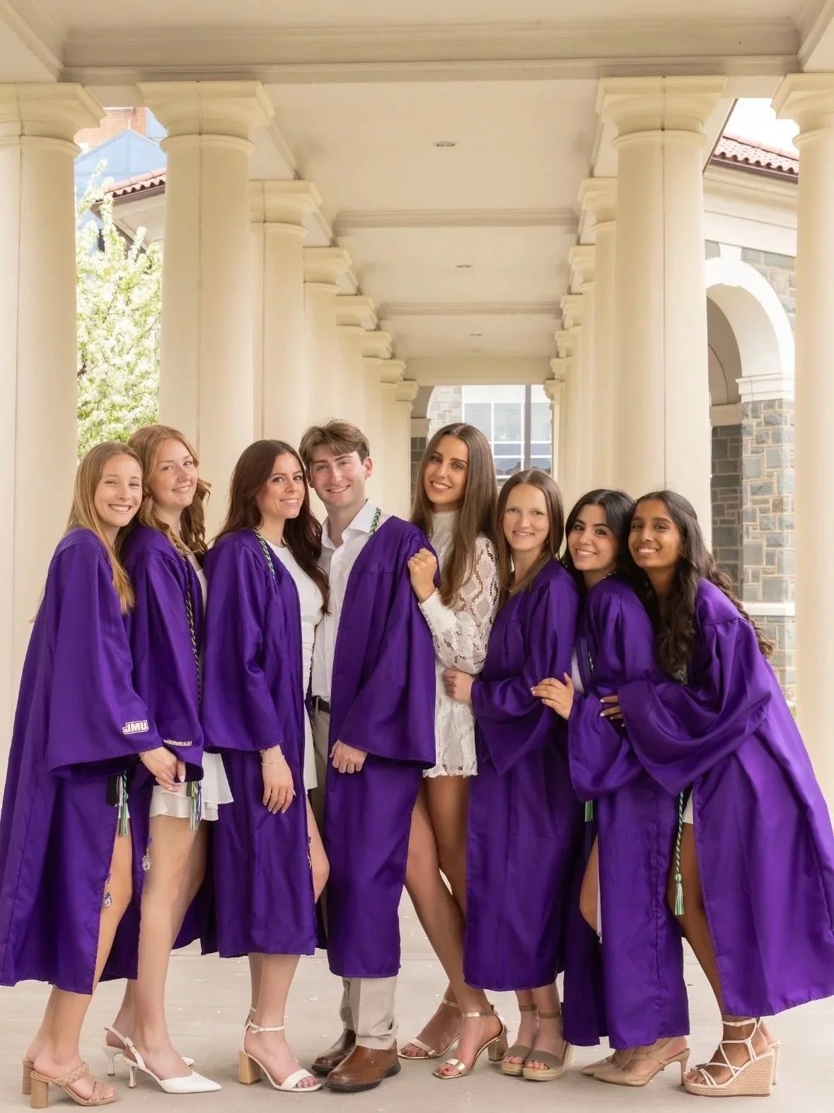 Joseph taking graduation photos with his friends