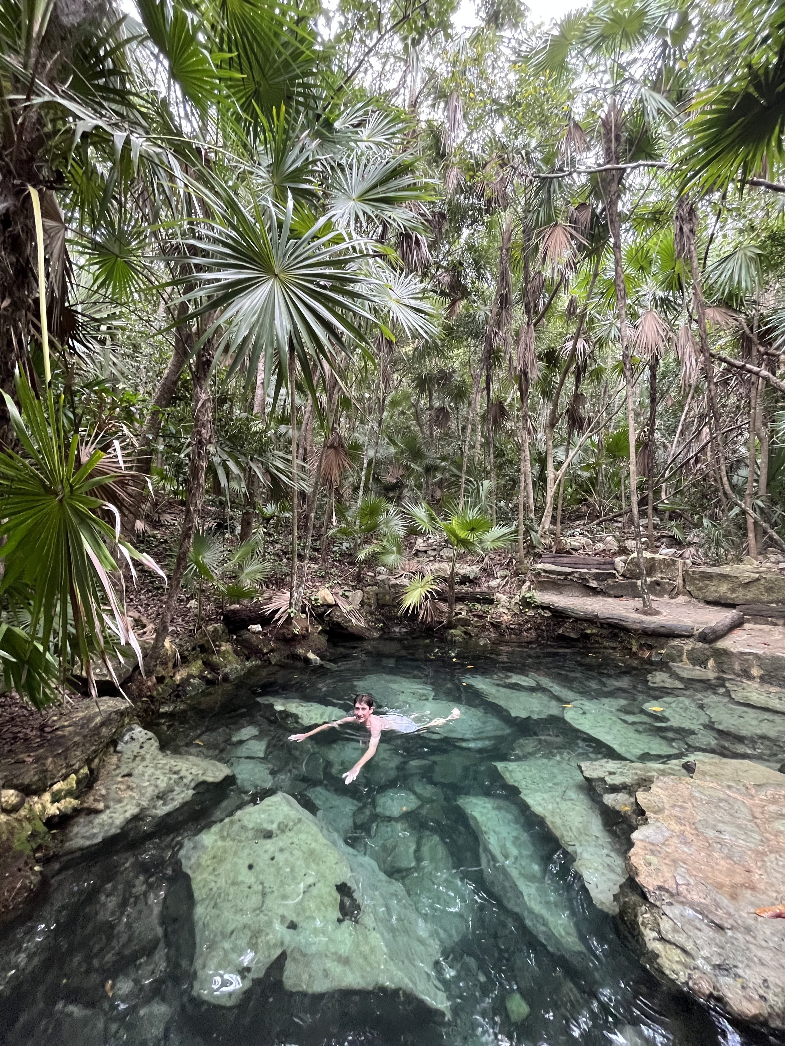 Joseph swimming in a Cenote in Playa del Carmen
