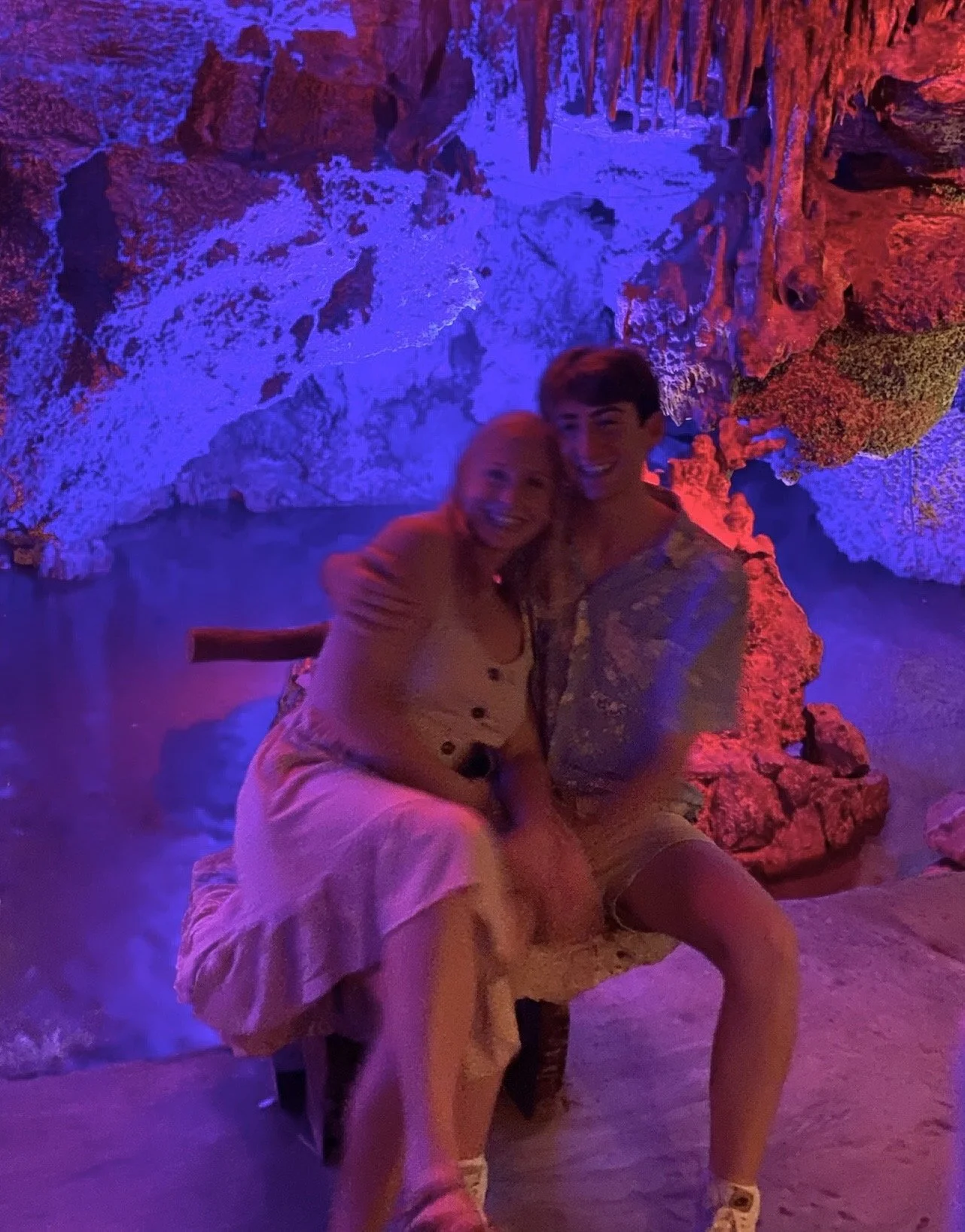 Joseph posing with his sister inside a cenote.