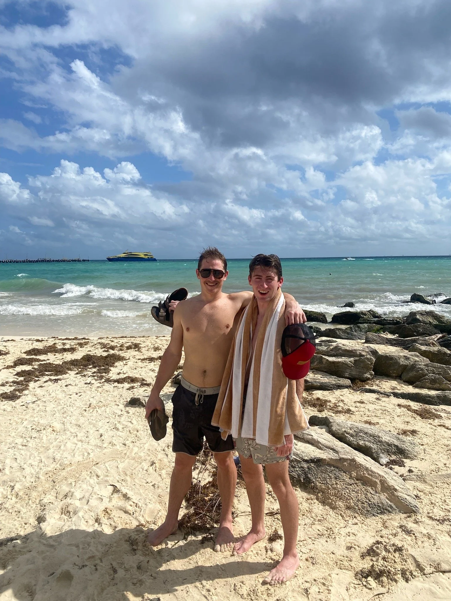 Joseph posing with his cousin on the beach.