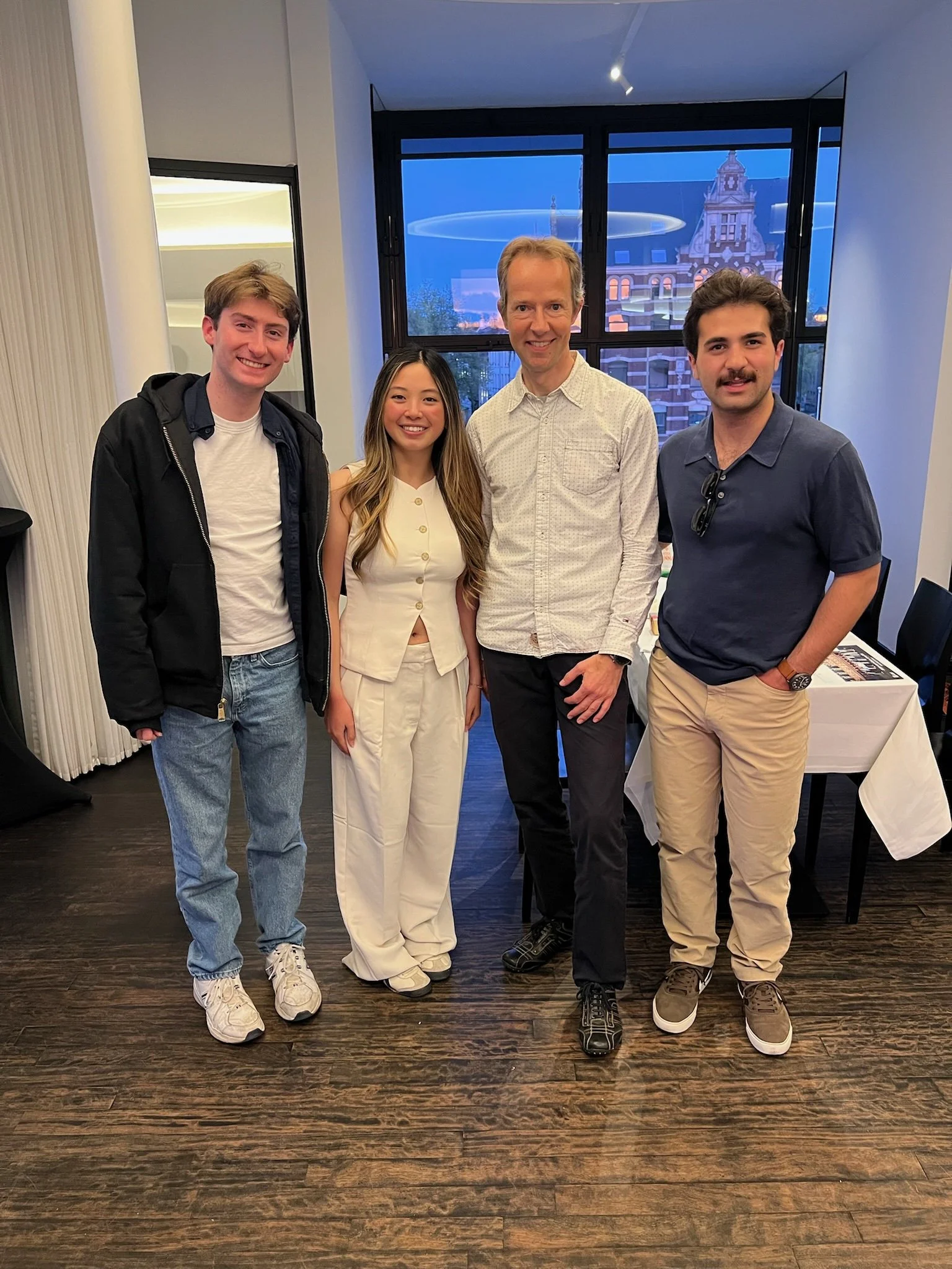 Photo of me, my two friends, and our operations professor at our end of semester dinner.