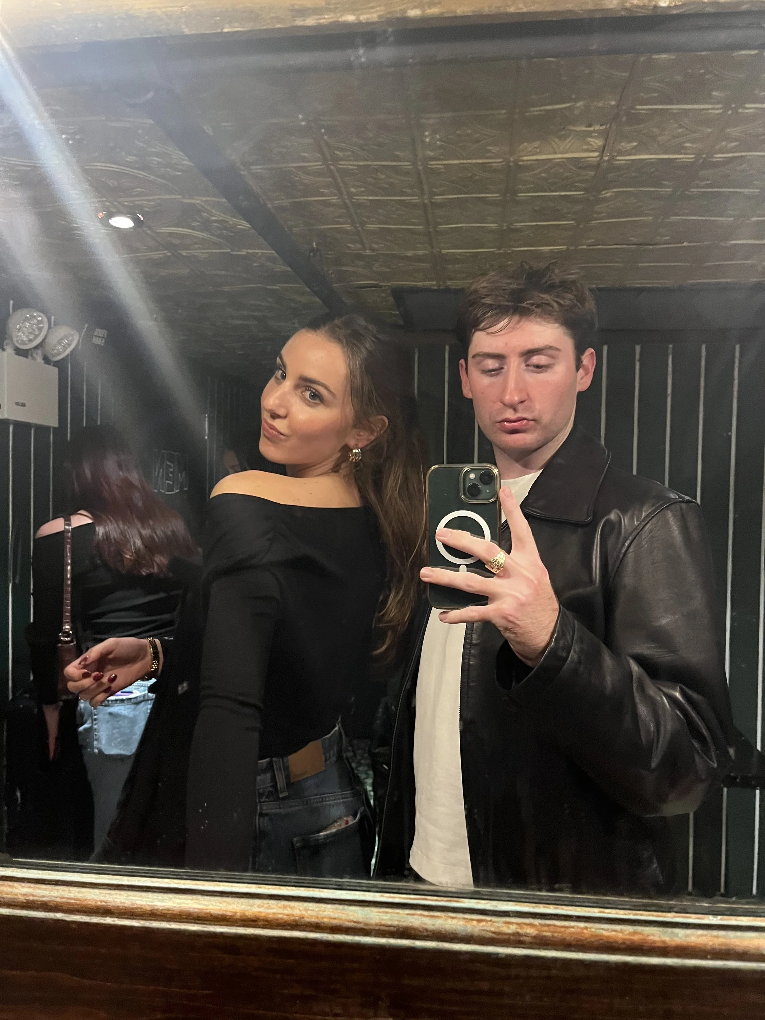 My friend and I taking a mirror selfie during a night out in west village.
