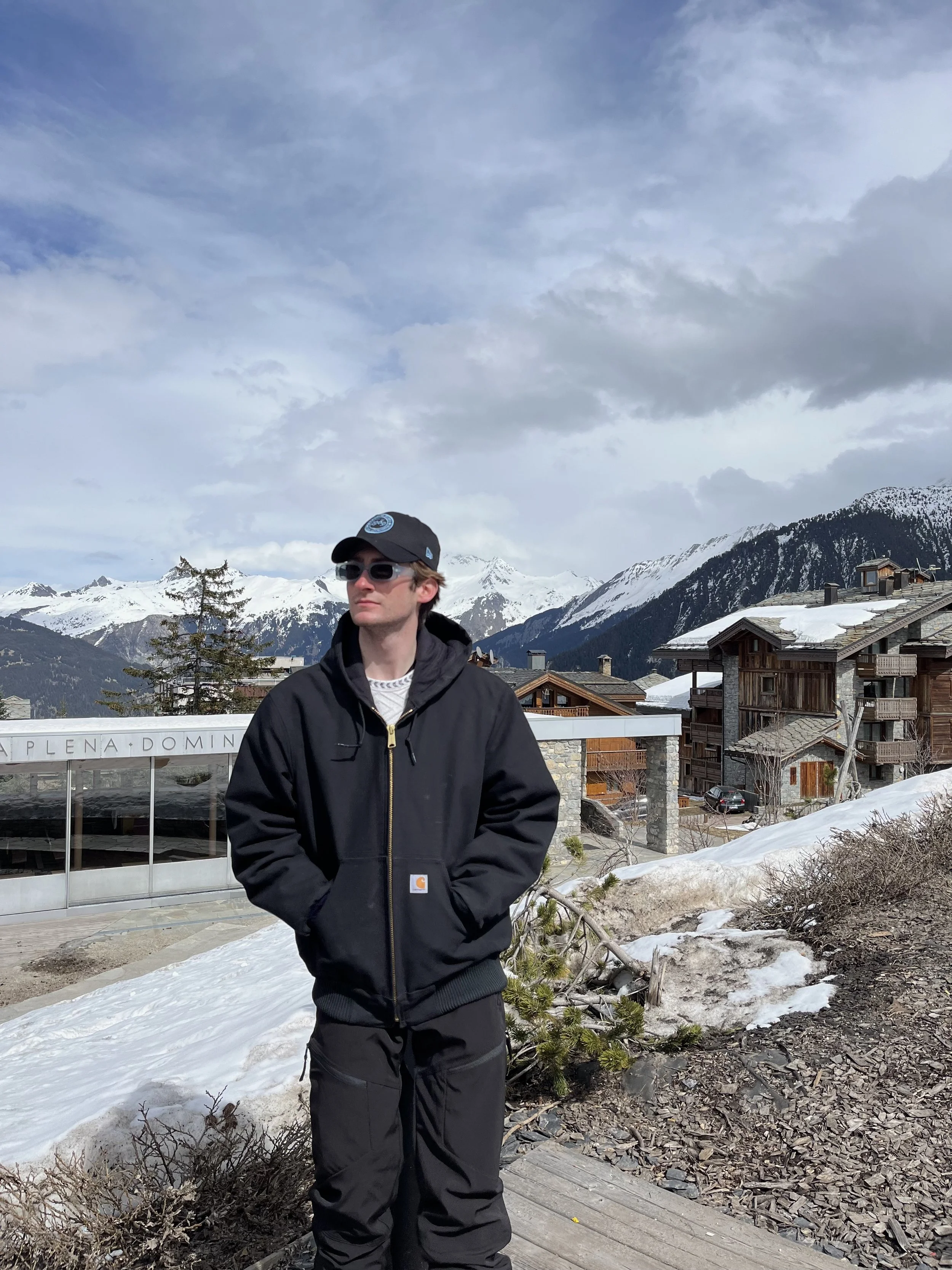 Myself posing in front of scenic views in Courchevel.