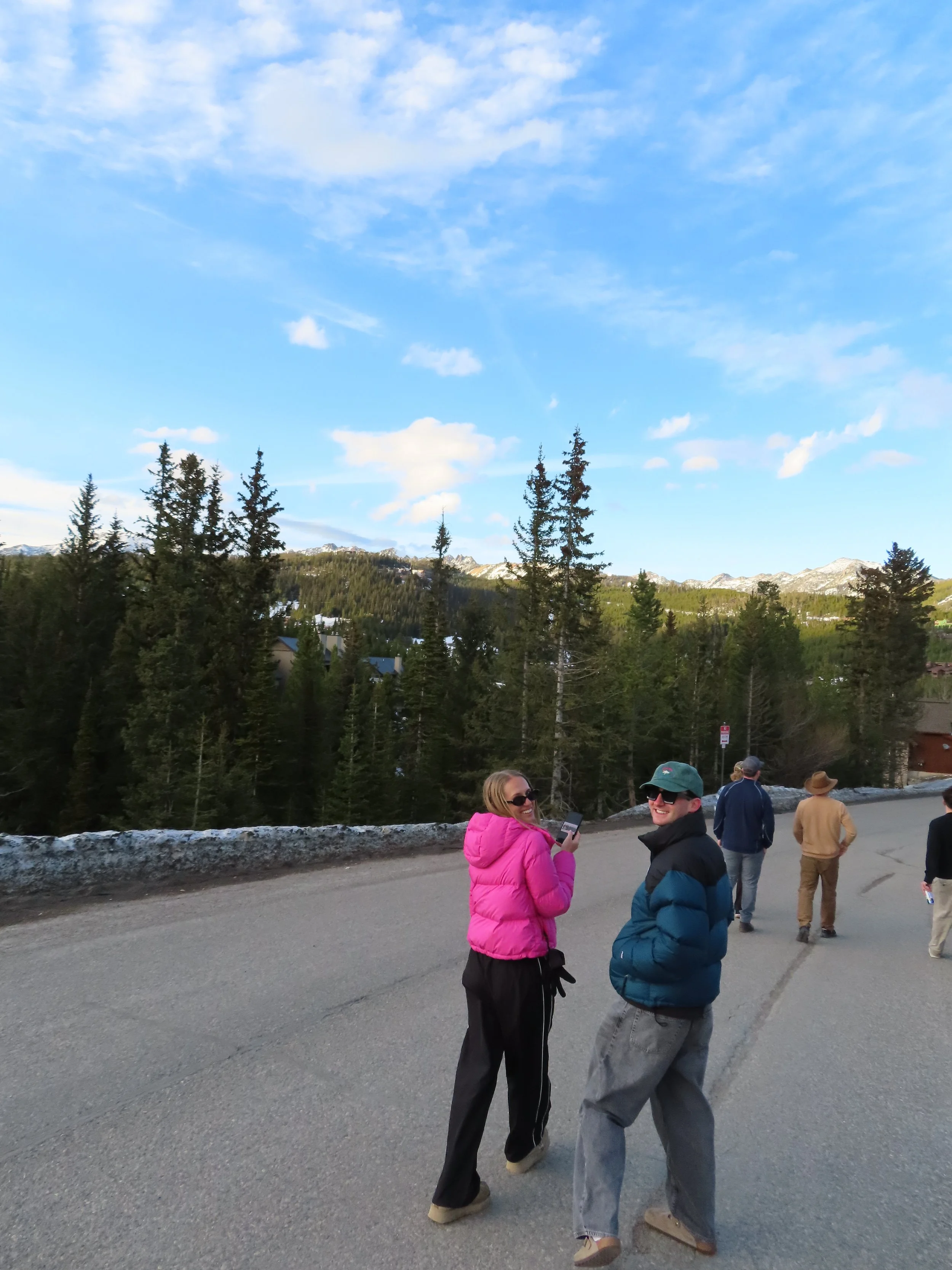 My cousin and I walking back to the air bnb with mountain views in the background.