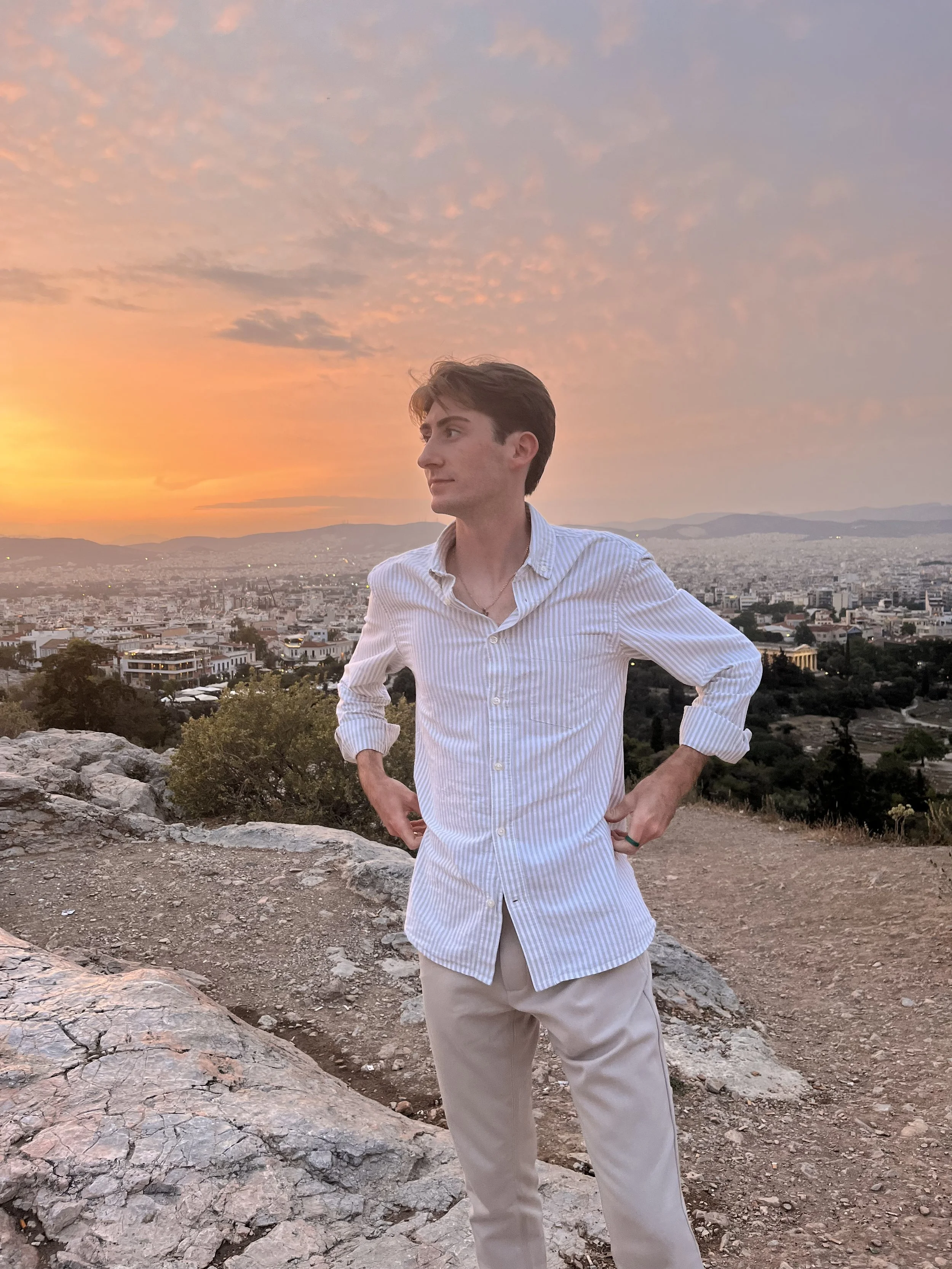 Joseph posing for the sunset in Athens.