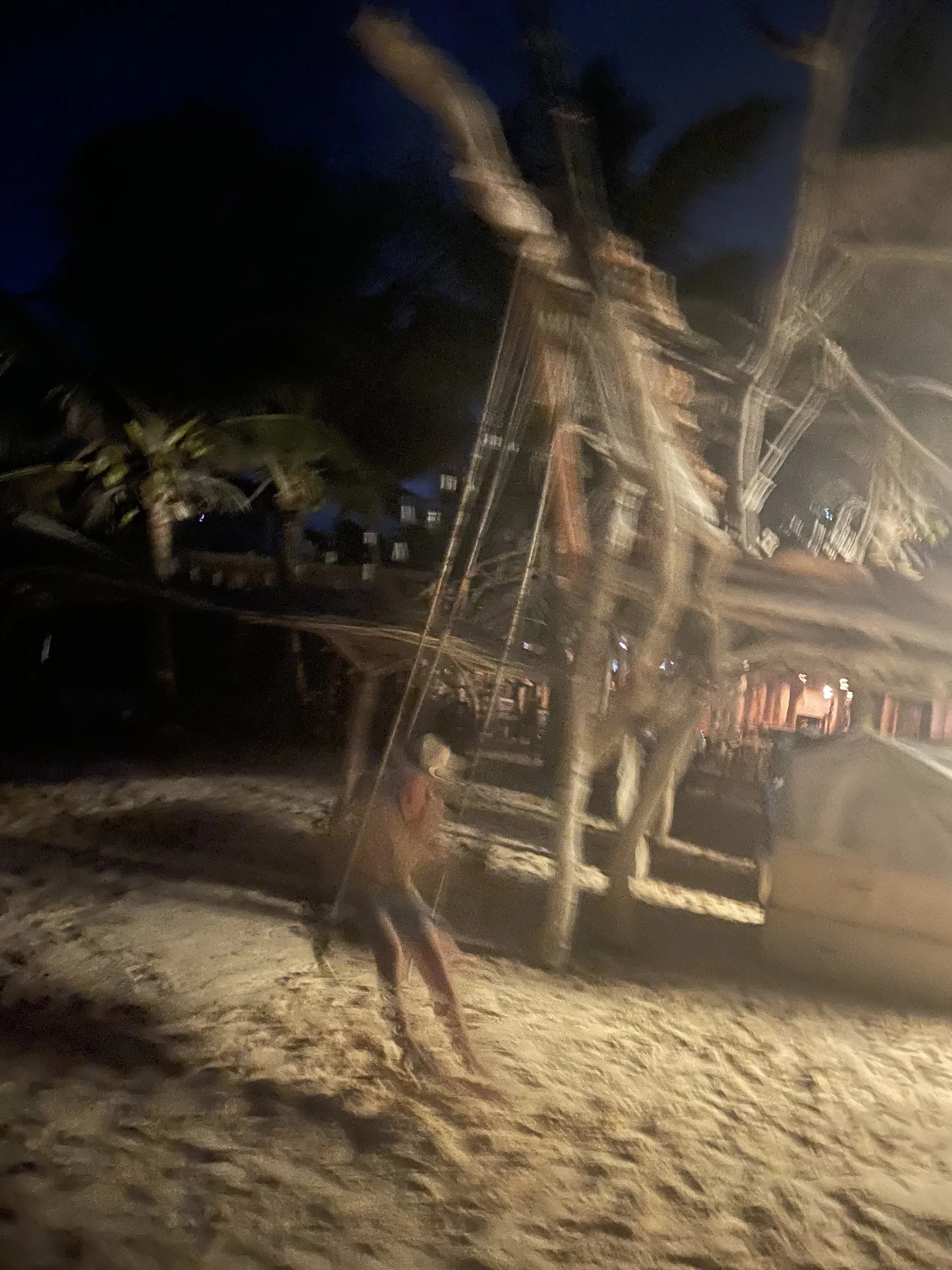 Joseph enjoying the evening on a beach swing
