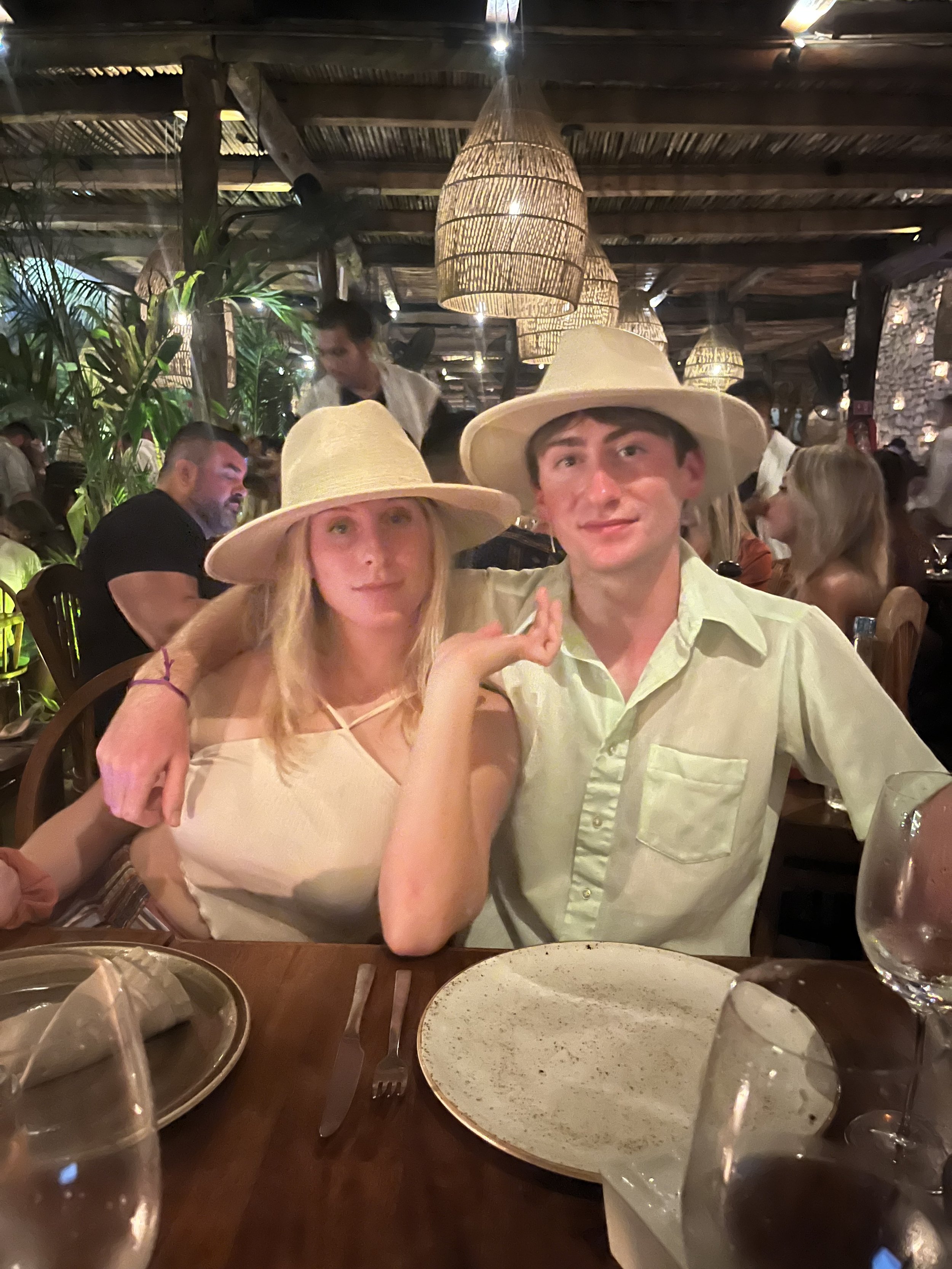 Joseph with his sister at dinner in Tulum