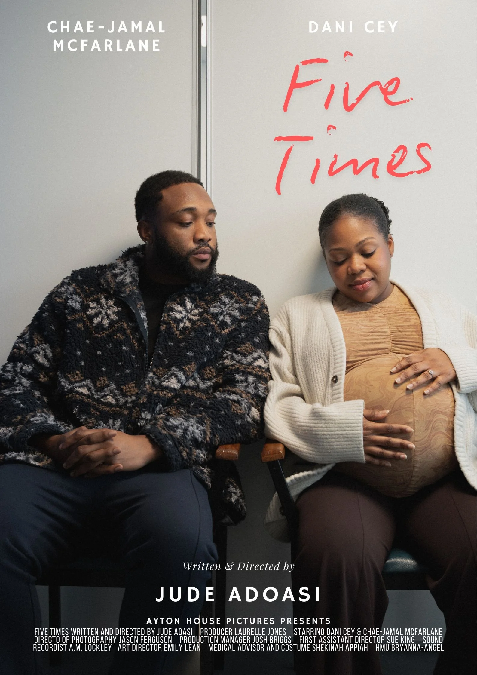A man and a pregnant woman sitting next to each other against a plain wall, with the woman touching her belly. The poster has the title 'Fire Times' written in red, and the names Chae-Jamal McFarlane, Dani Cey, and Jude Adoasi.