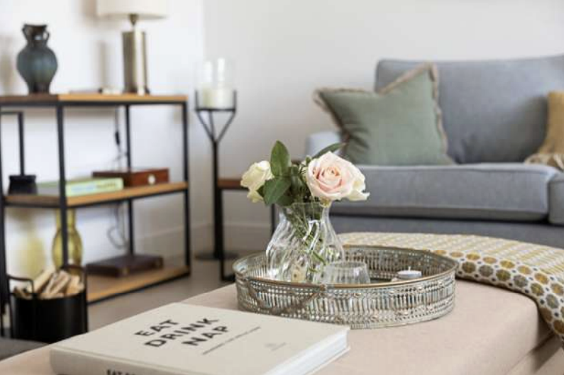 Styled living room at The Dairy with soft neutral palette and layered textures