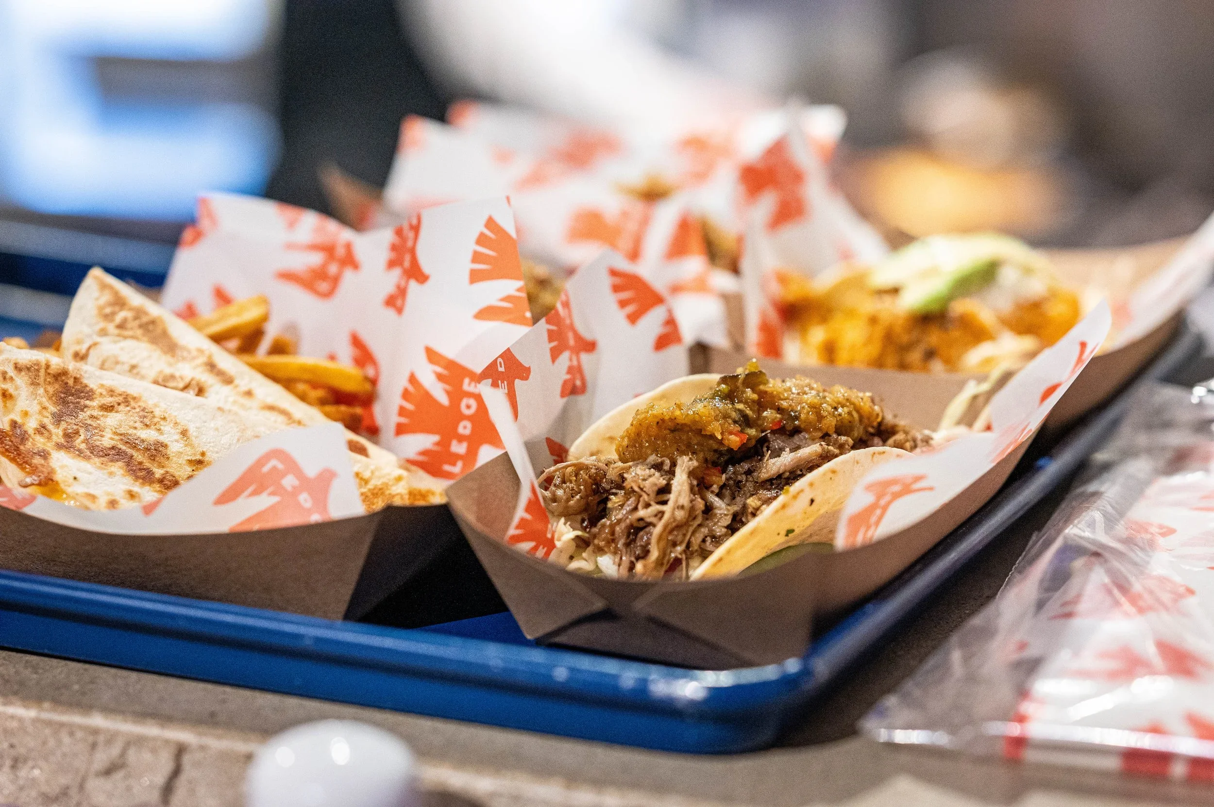 Tacos, quesadilla, fries on tray