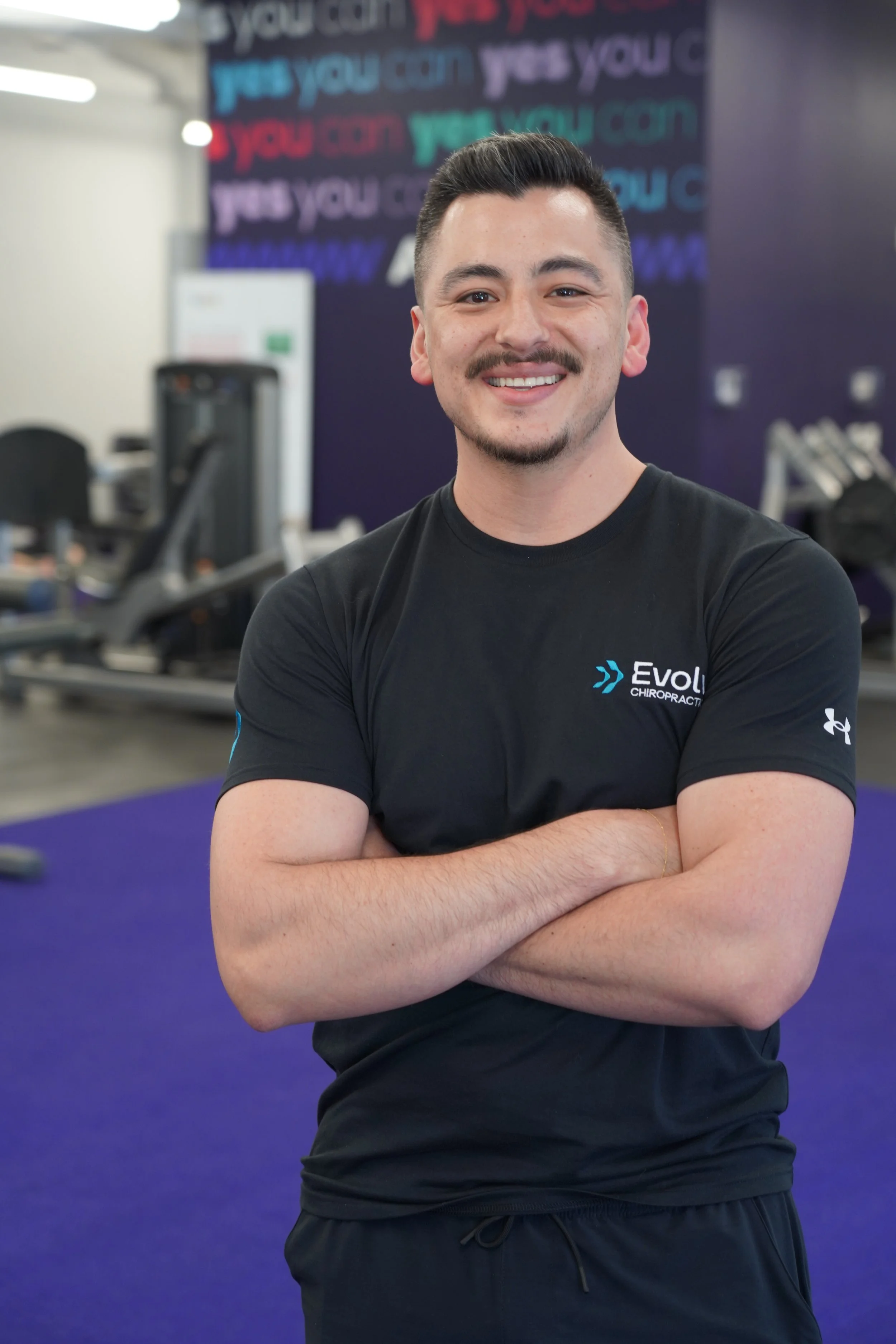 Dr. Cruz Orona meeting with patients at Evolv Chiropractic movement clinic in Dallas