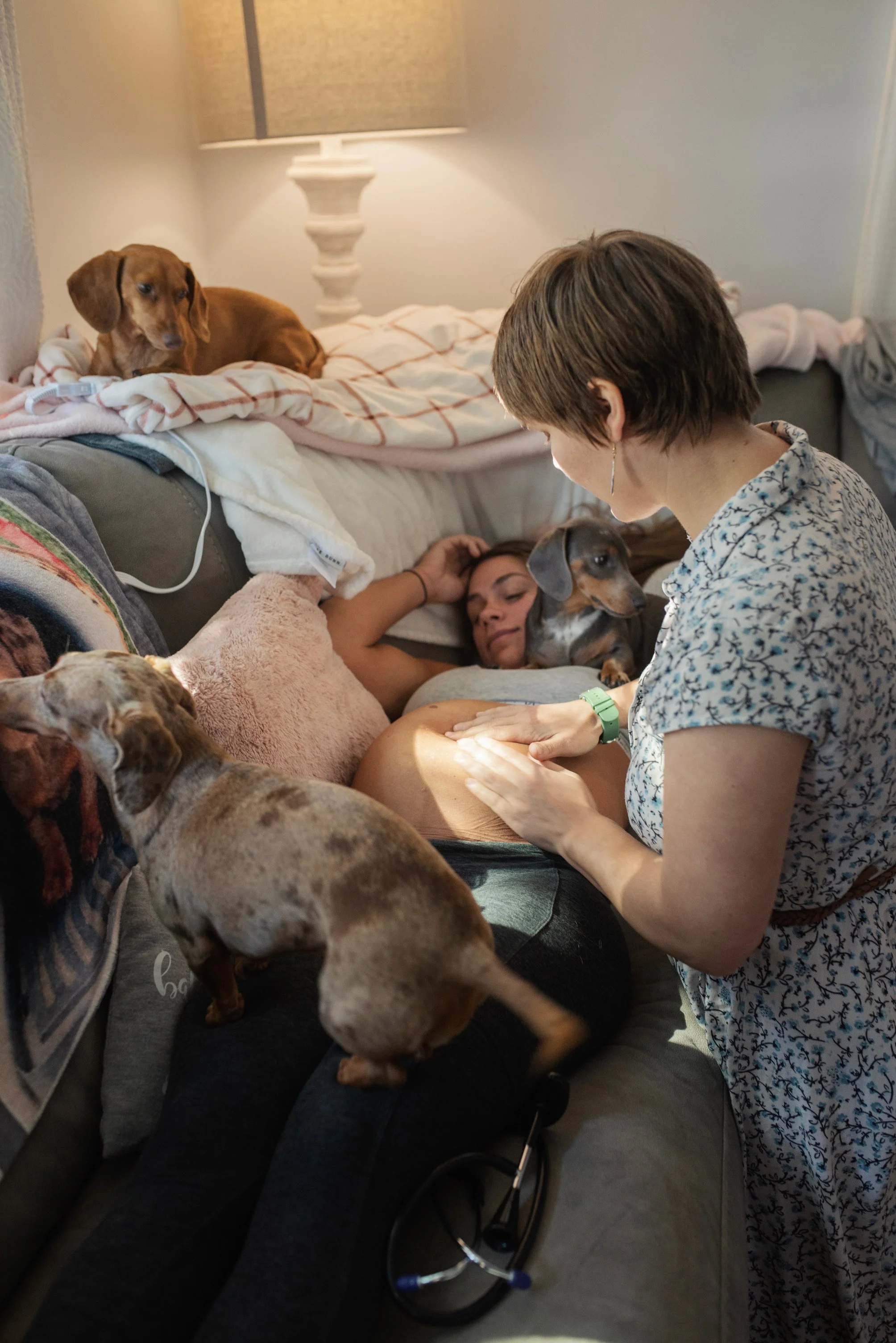 Midwife Sarah Mead performing a prenatal exam