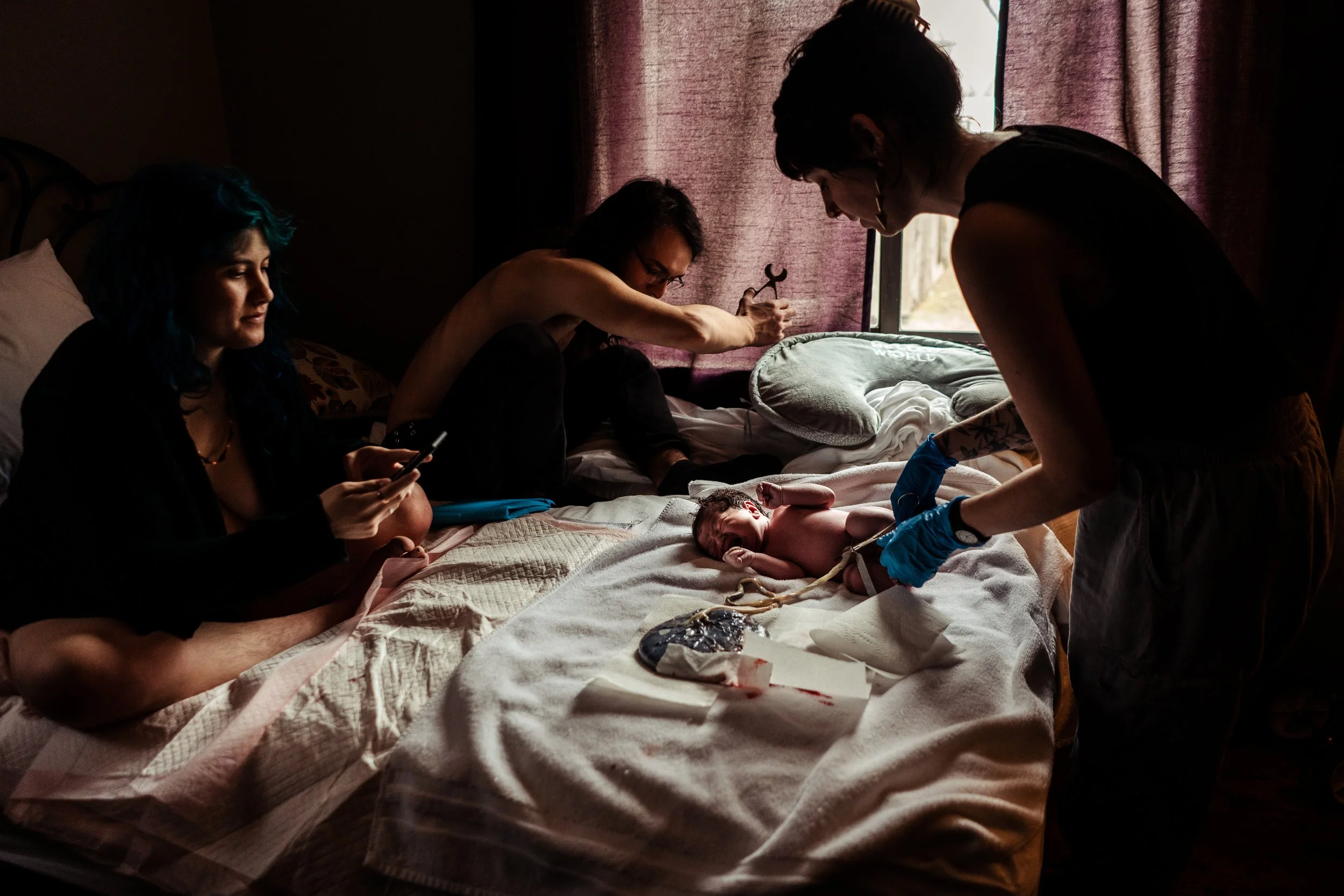 Midwife Kennedy Logan performing a newborn exam