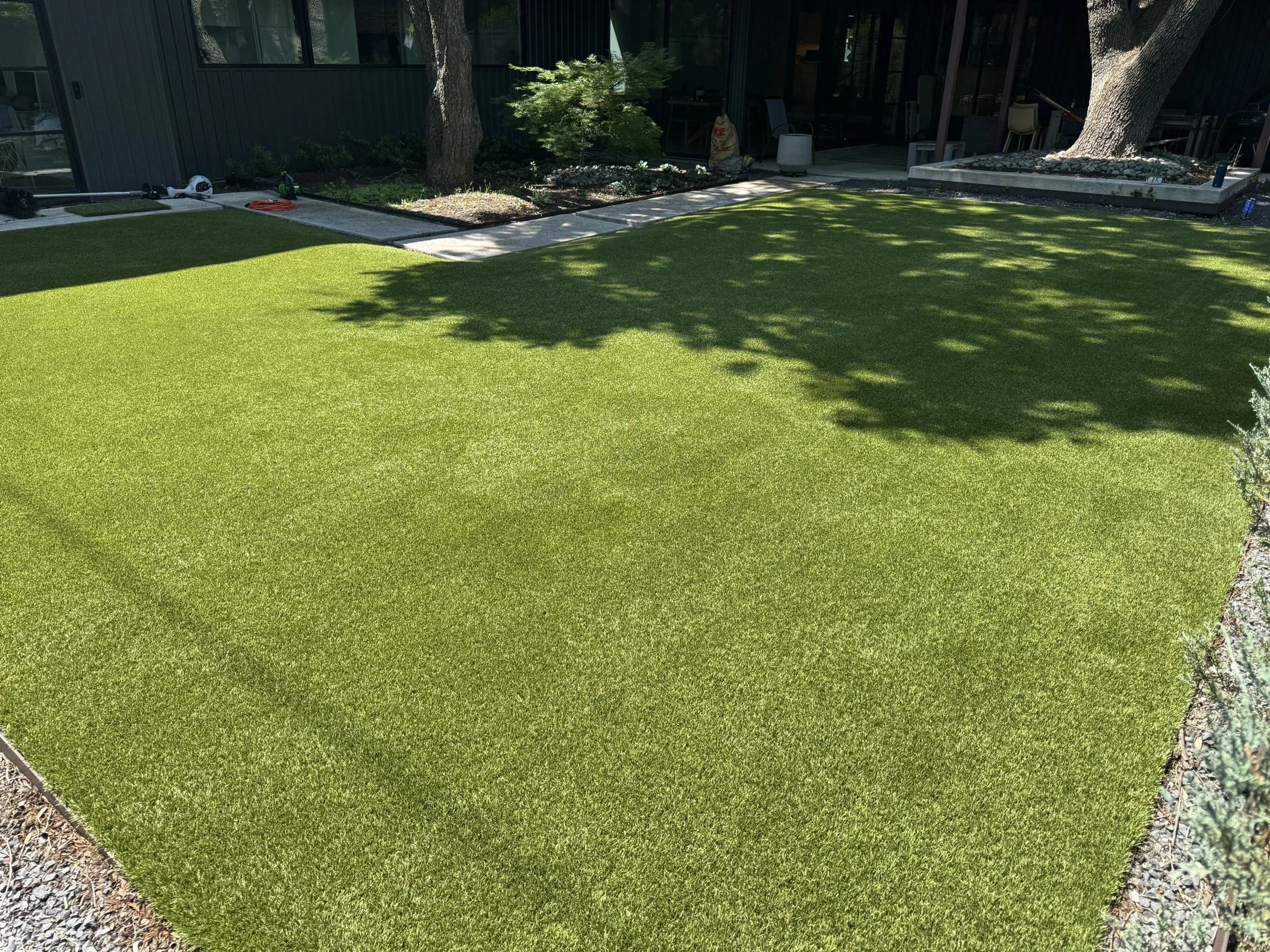 Artificial turf fibers standing tall after power-broom cleaning in Dallas