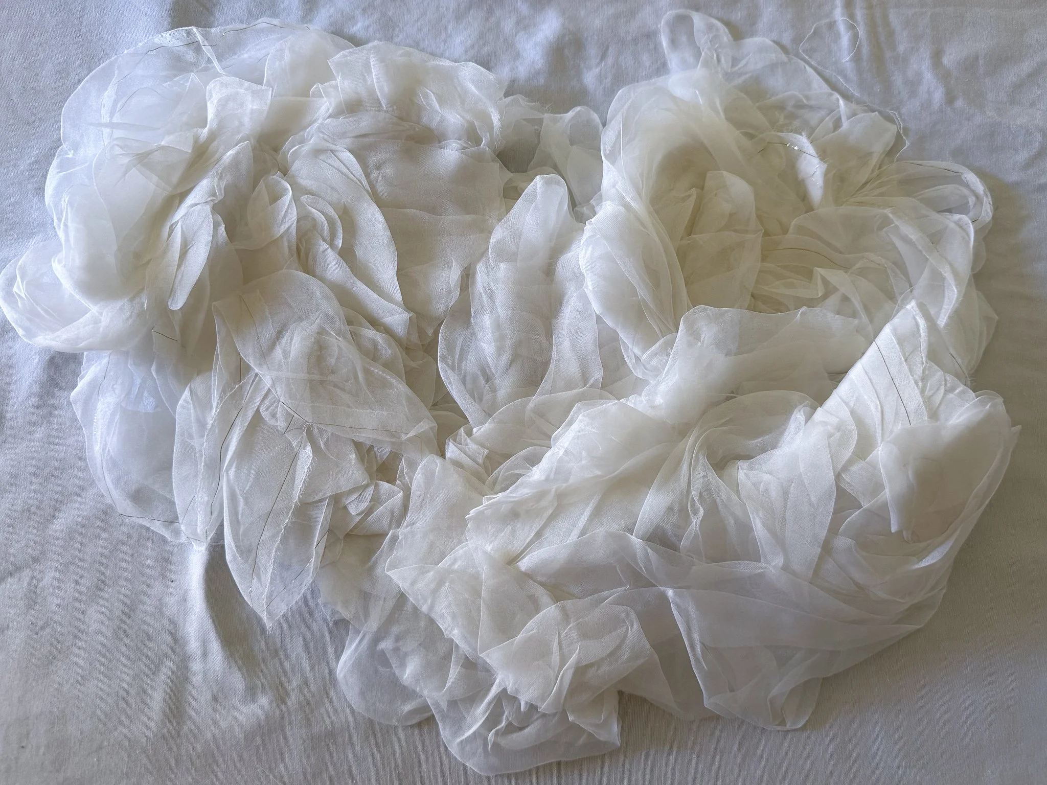 White prepared for dye silk organza scrunched into cloud-like forms