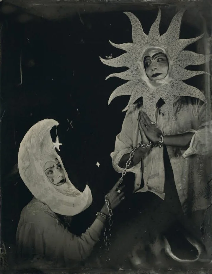 an artistic, otherworldly looking tintype portrait portrait of a couple dress up as a sun and moon bound in chains made in NYC