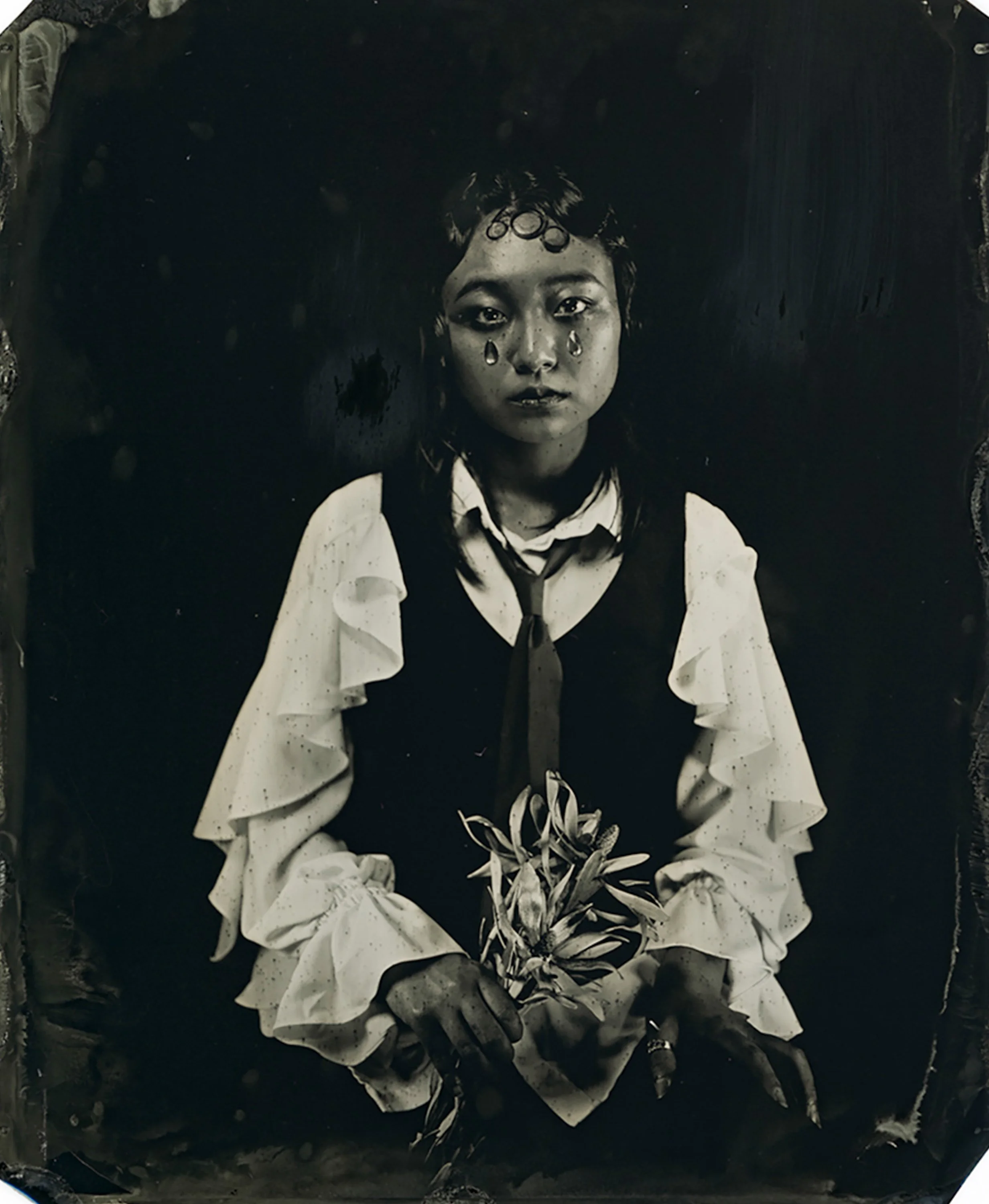an artistic tintype portrait of a young Korean person with 20s style hair and fake tears under their eyes