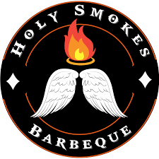 Logo for Holy Smokes Barbeque featuring a flaming torch flanked by angel wings, with the words 'Holy Smokes' above and 'Barbeque' below.
