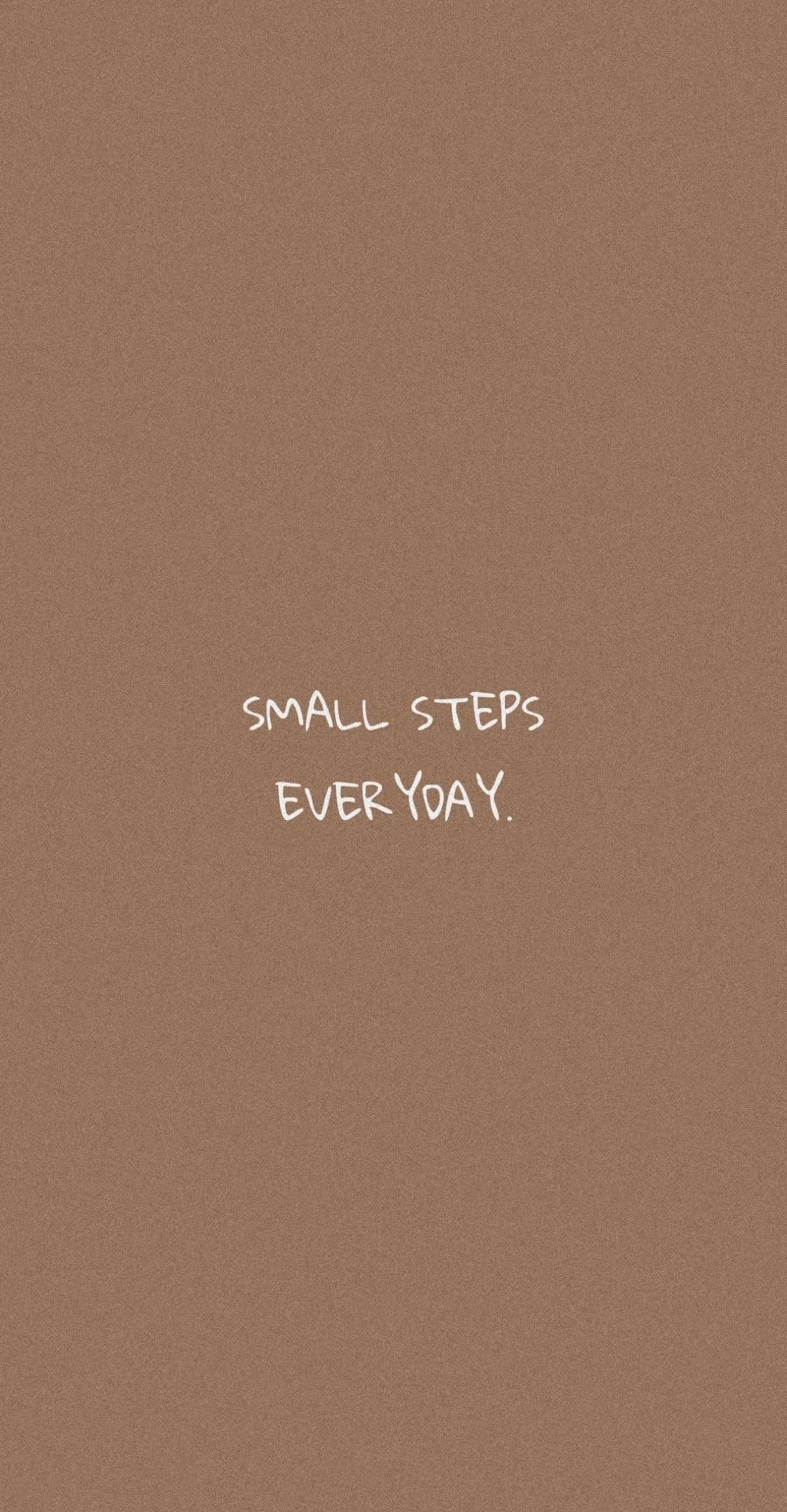 Brown background with white handwritten font that says, "Small steps every day."