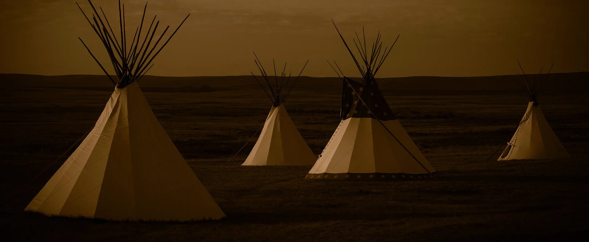 Toned with Edward Curtis style 4 Tipis at dawn of the Blackfeet Reservation by Brady Willette