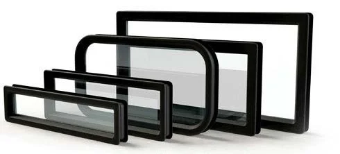 Stack of various-sized black rectangular industrial door windows