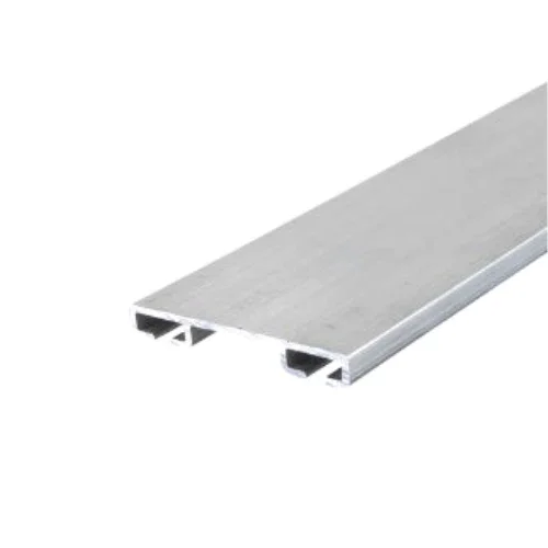 Close-up of a silver metal extrusion, likely aluminum, with a flat top and hollow rectangular channels underneath, used for construction or framing.