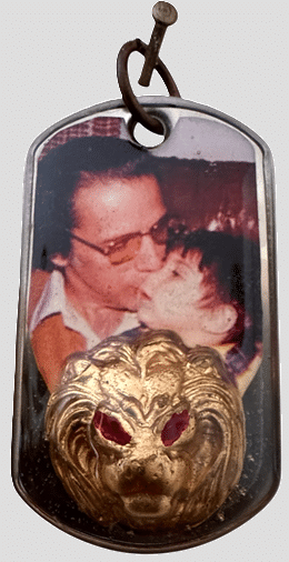 The original WickedTag proof of concept using a vintage photo of a grandfather with his grandson. A gold lion face charm with red eyes is built into to the tag.
