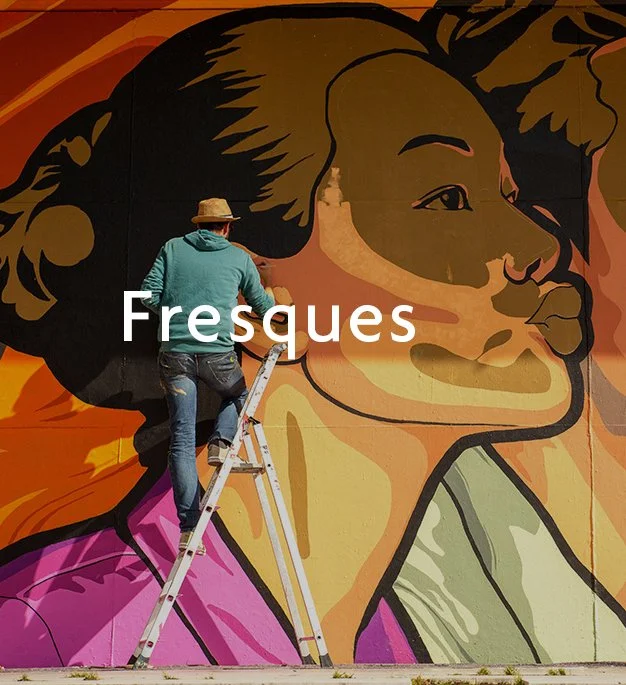 Street Artist JBC painting a mural in Bourges, France.