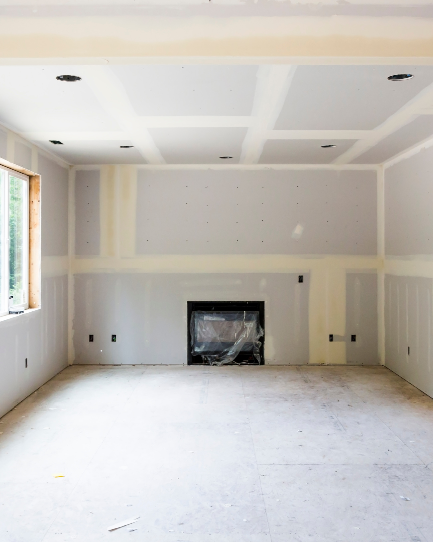 Living Room with Drywall and Fireplace