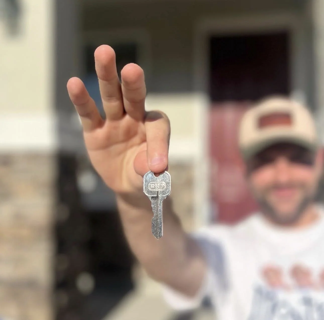 Stefano Hristov Buyers Holding a Key to Their Home