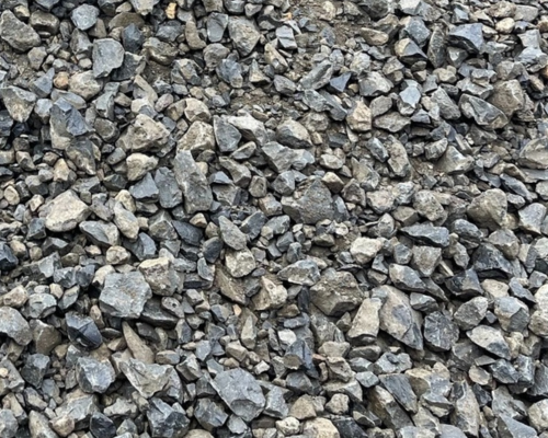 Close-up of gray gravel stones of various sizes.