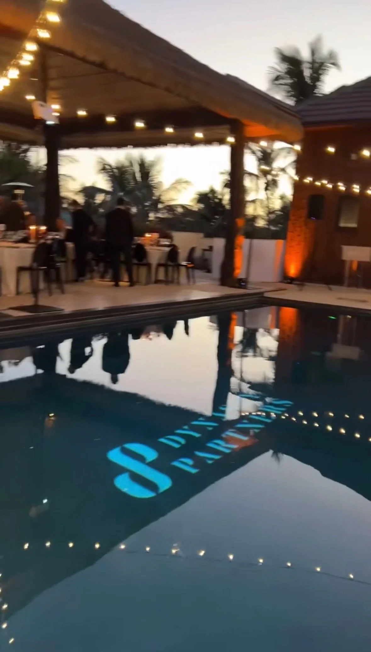 Custom wedding monogram projection on wall at Miami reception venue