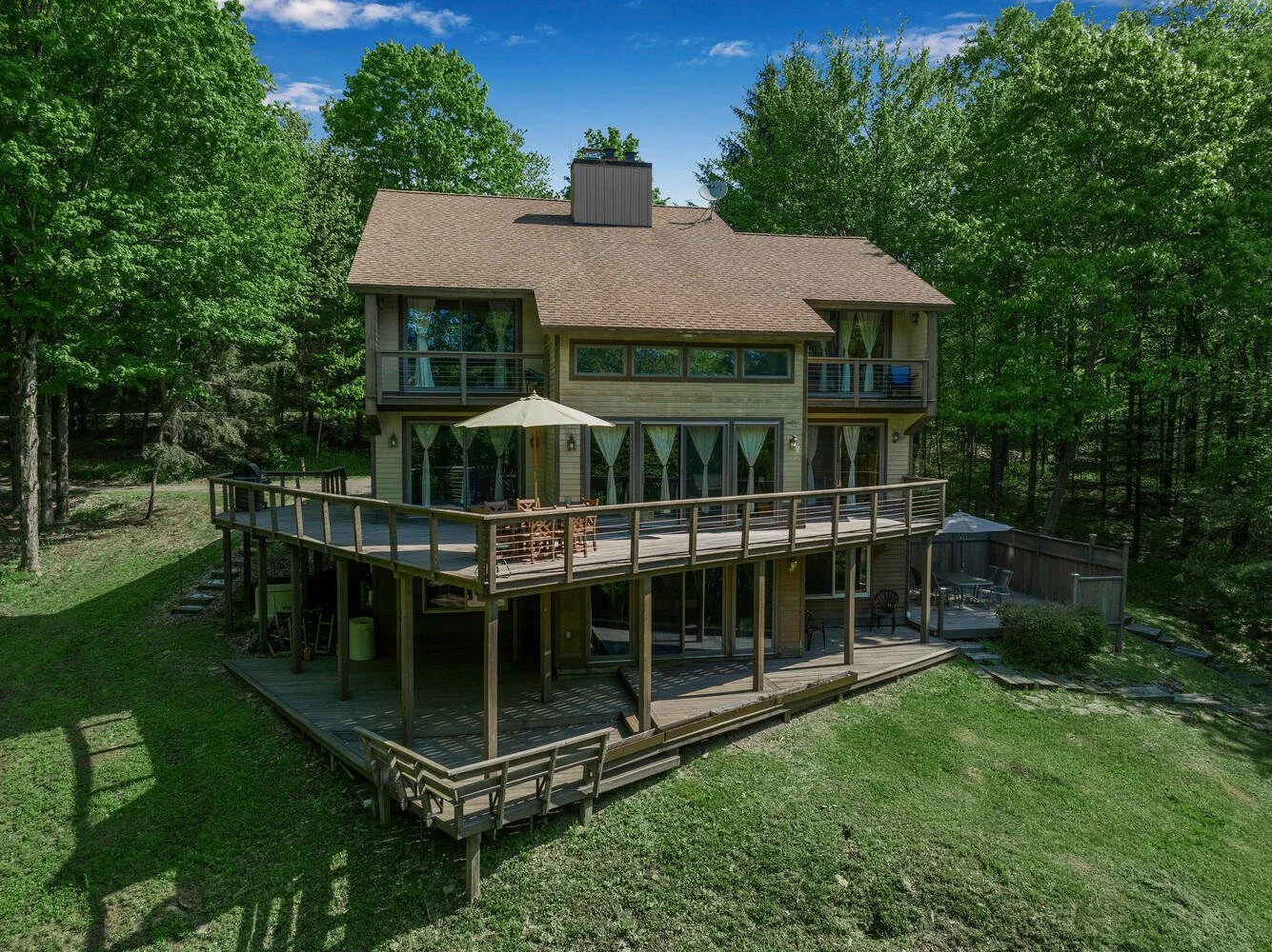 Beautiful 6-bedroom chalet with wrap around decks , hot tub, sauna, gym, game room with space for everyone!