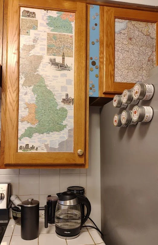 Map art on cabinets in kitchen